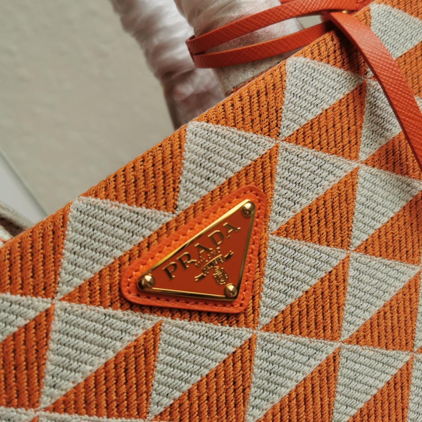 Pra*a symbole small bag in orange and white jacquard fabric