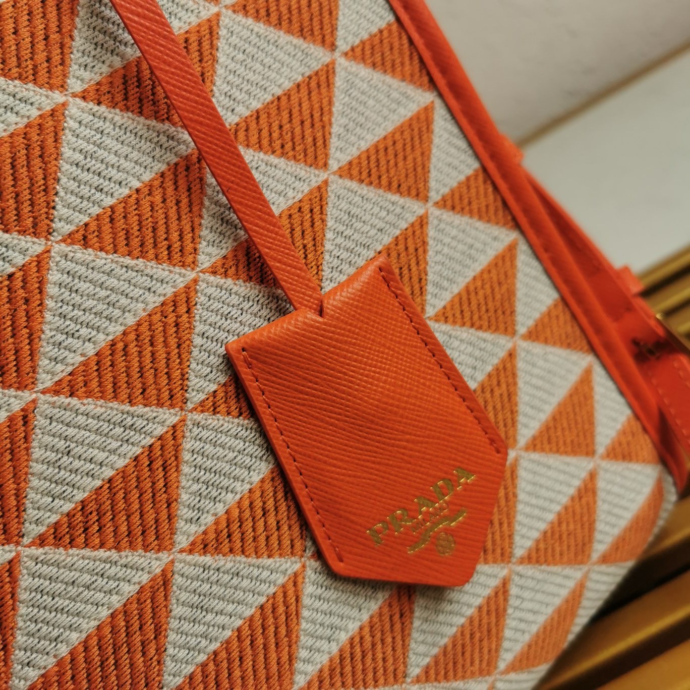 Pra*a symbole small bag in orange and white jacquard fabric