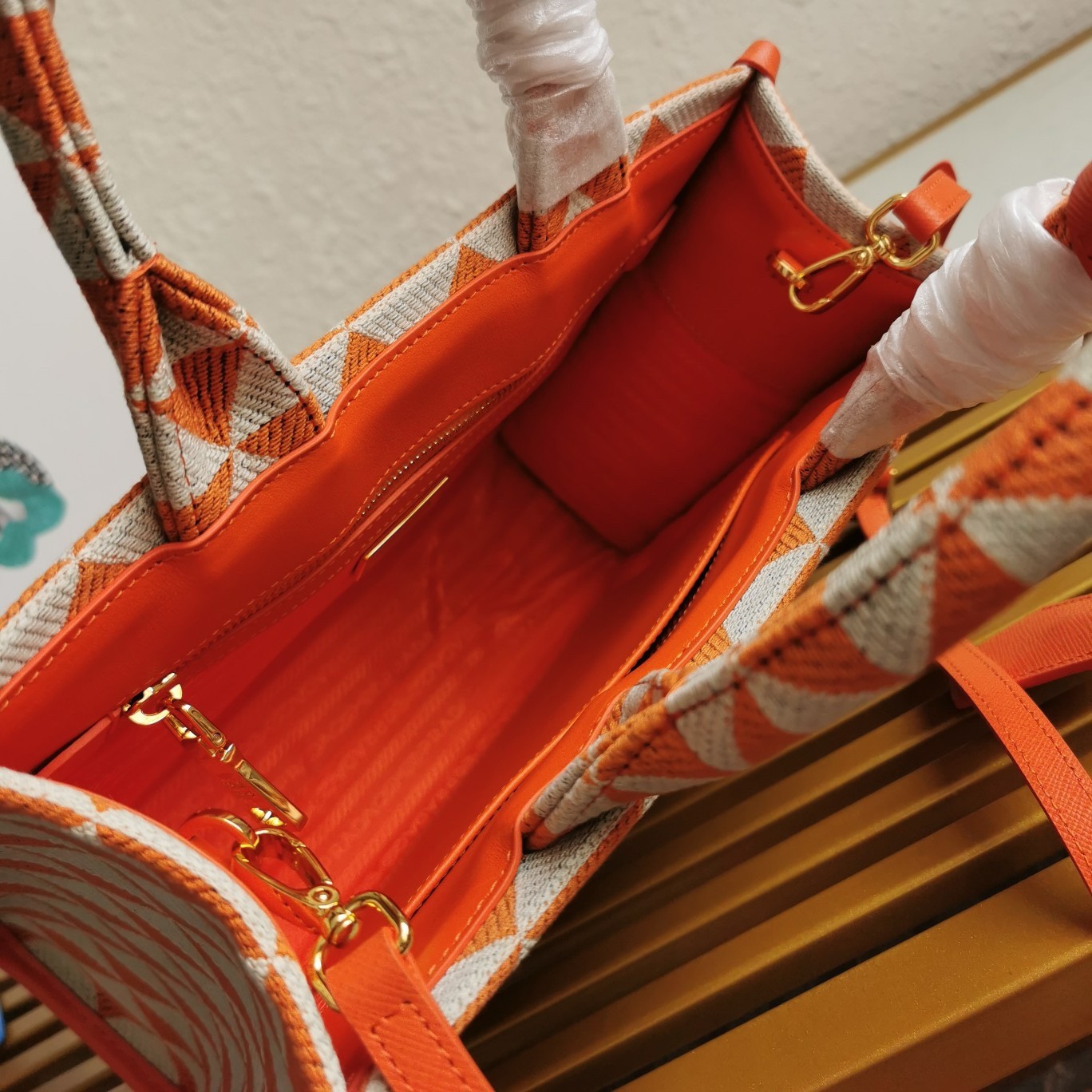 Pra*a symbole small bag in orange and white jacquard fabric