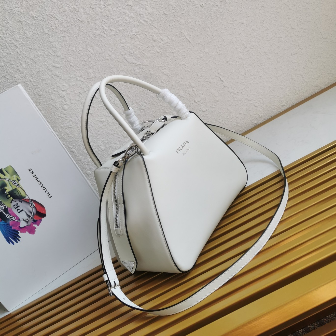 pra*a S*pernova small handbag in white leather