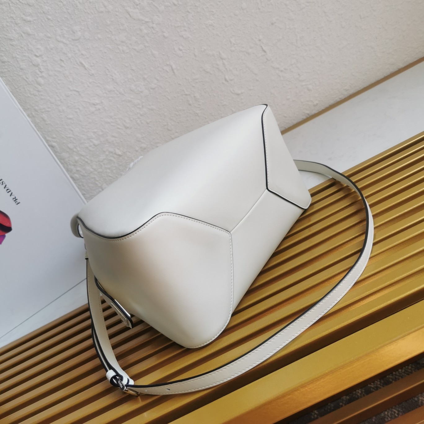 pra*a S*pernova small handbag in white leather