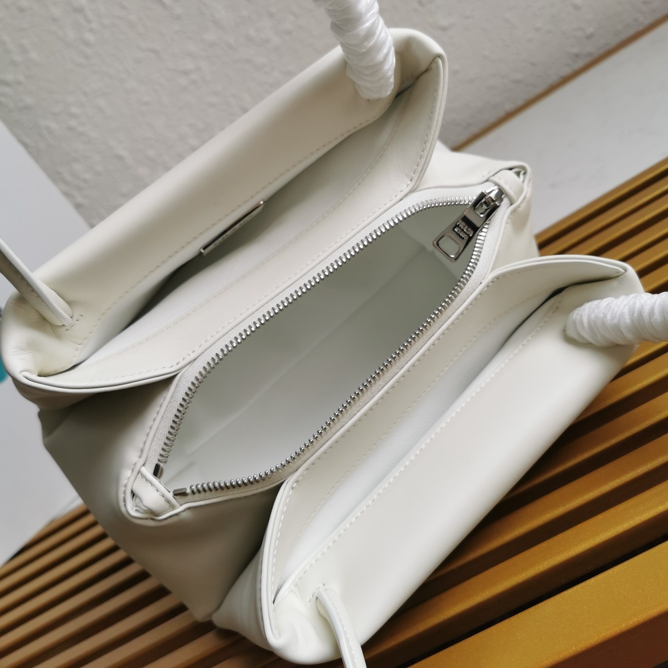 pra*a S*pernova small shoulder bag in white leather