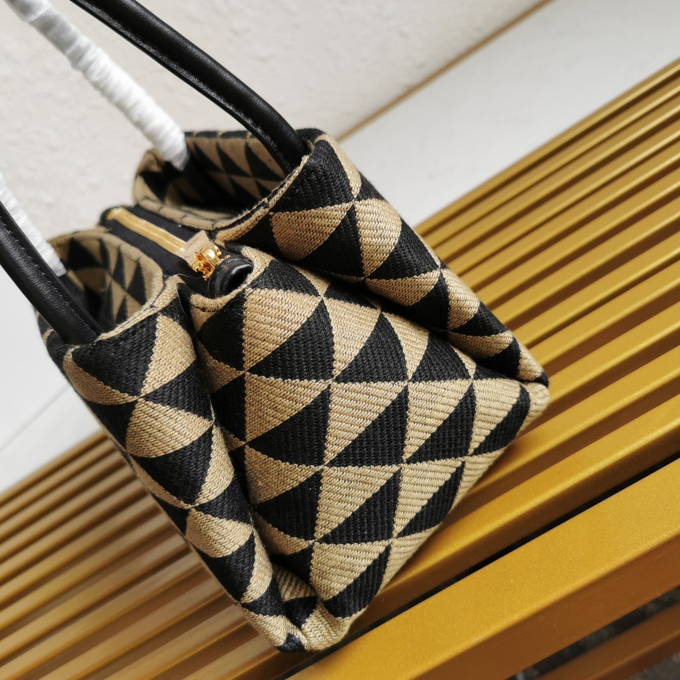 pra*a S*pernova small shoulder bag in black/beige fabric