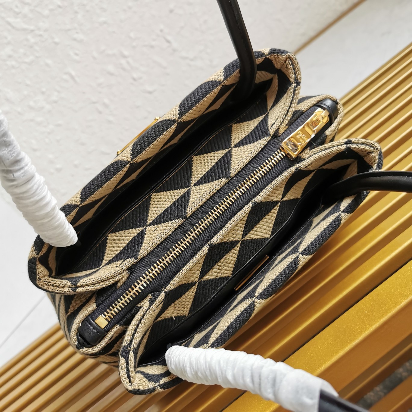 pra*a S*pernova small shoulder bag in black/beige fabric
