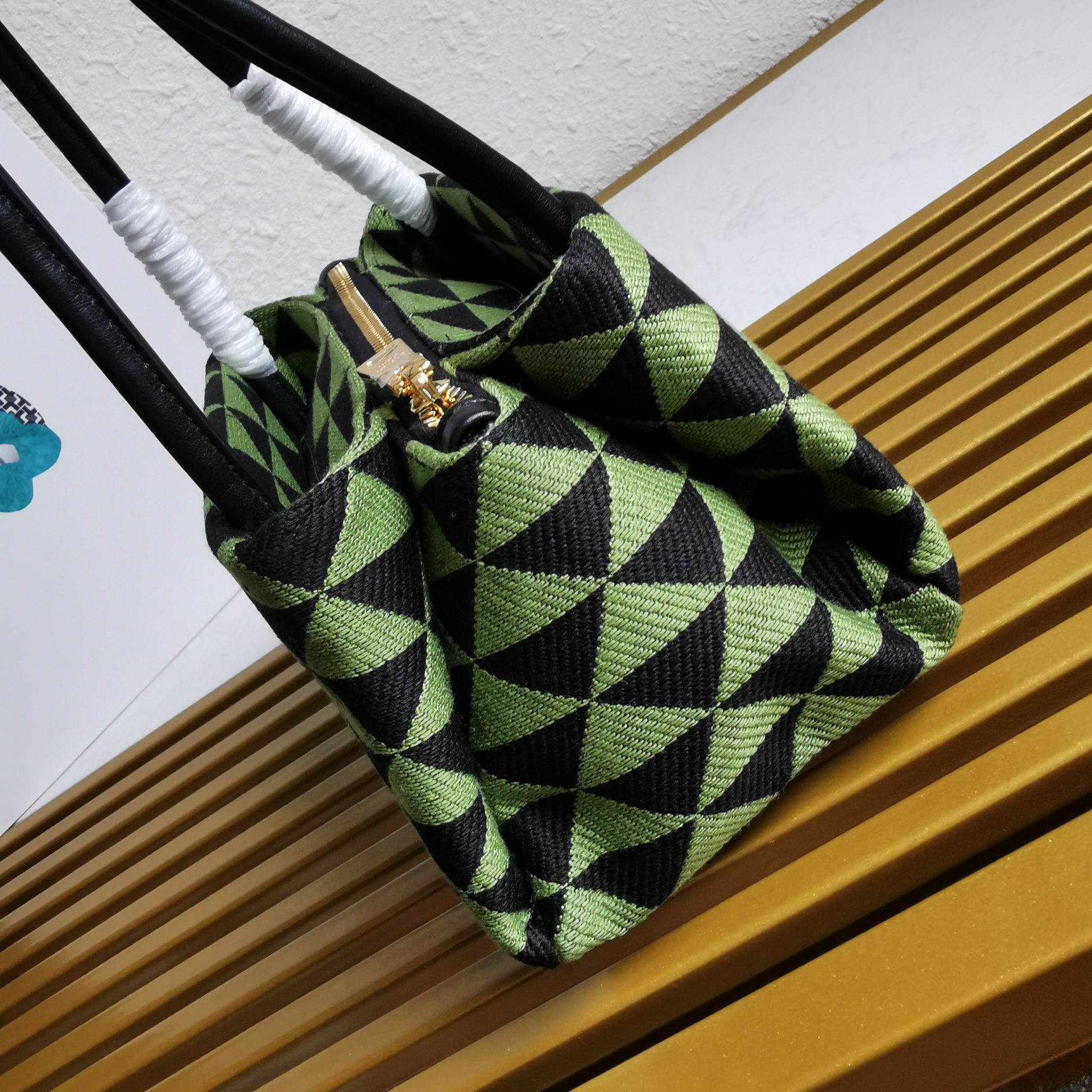 pra*a S*pernova small shoulder bag in black/green fabric