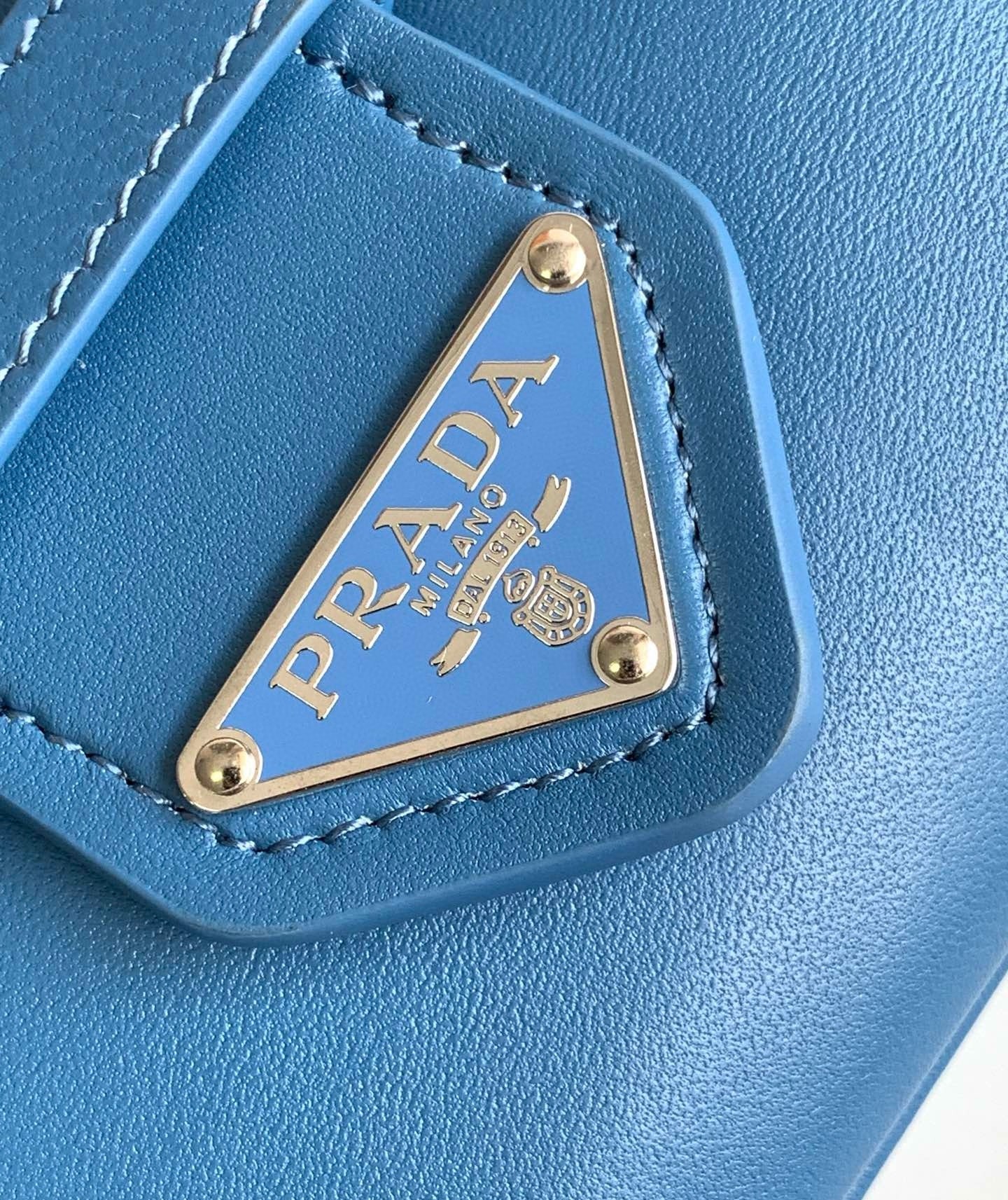 Pra*a moon bag in blue padded nappa leather