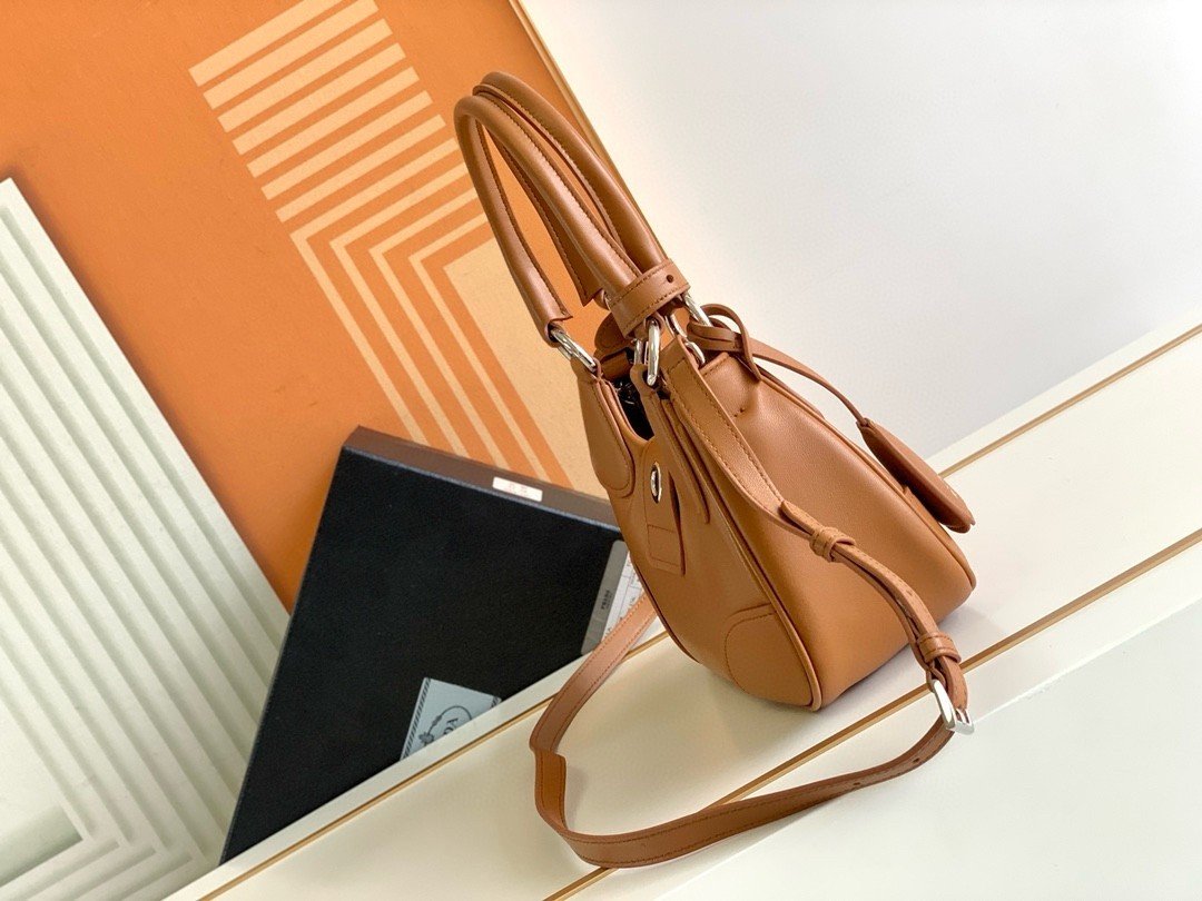 Pra*a moon bag in caramel padded nappa leather