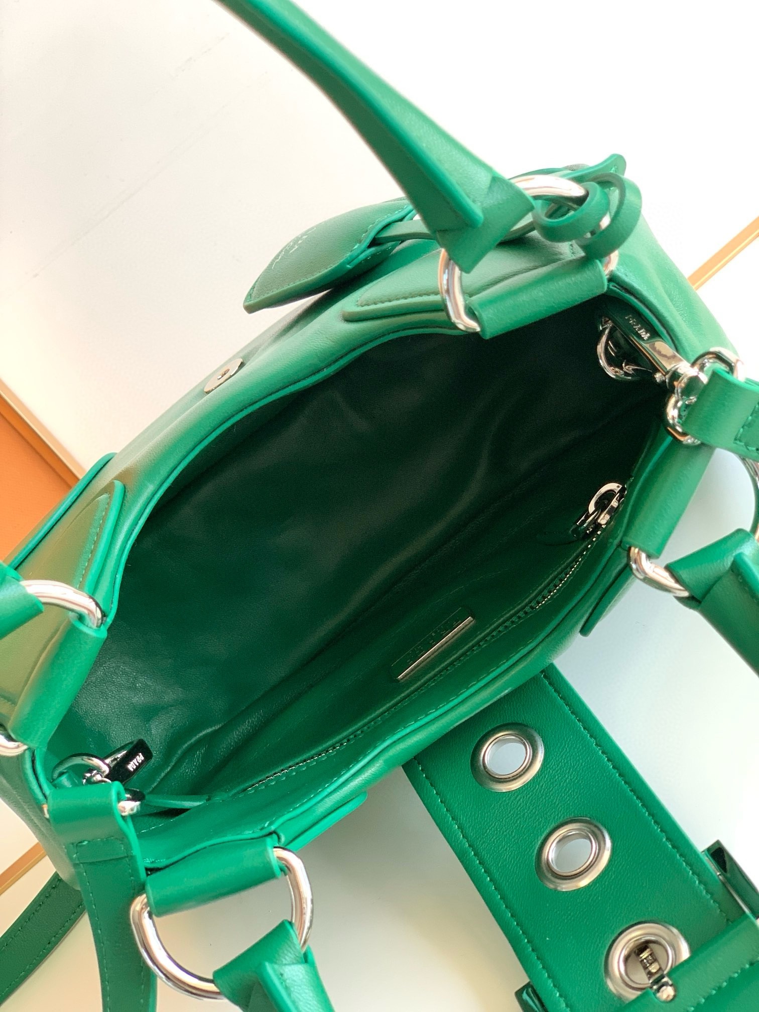 Pra*a moon bag in green padded nappa leather