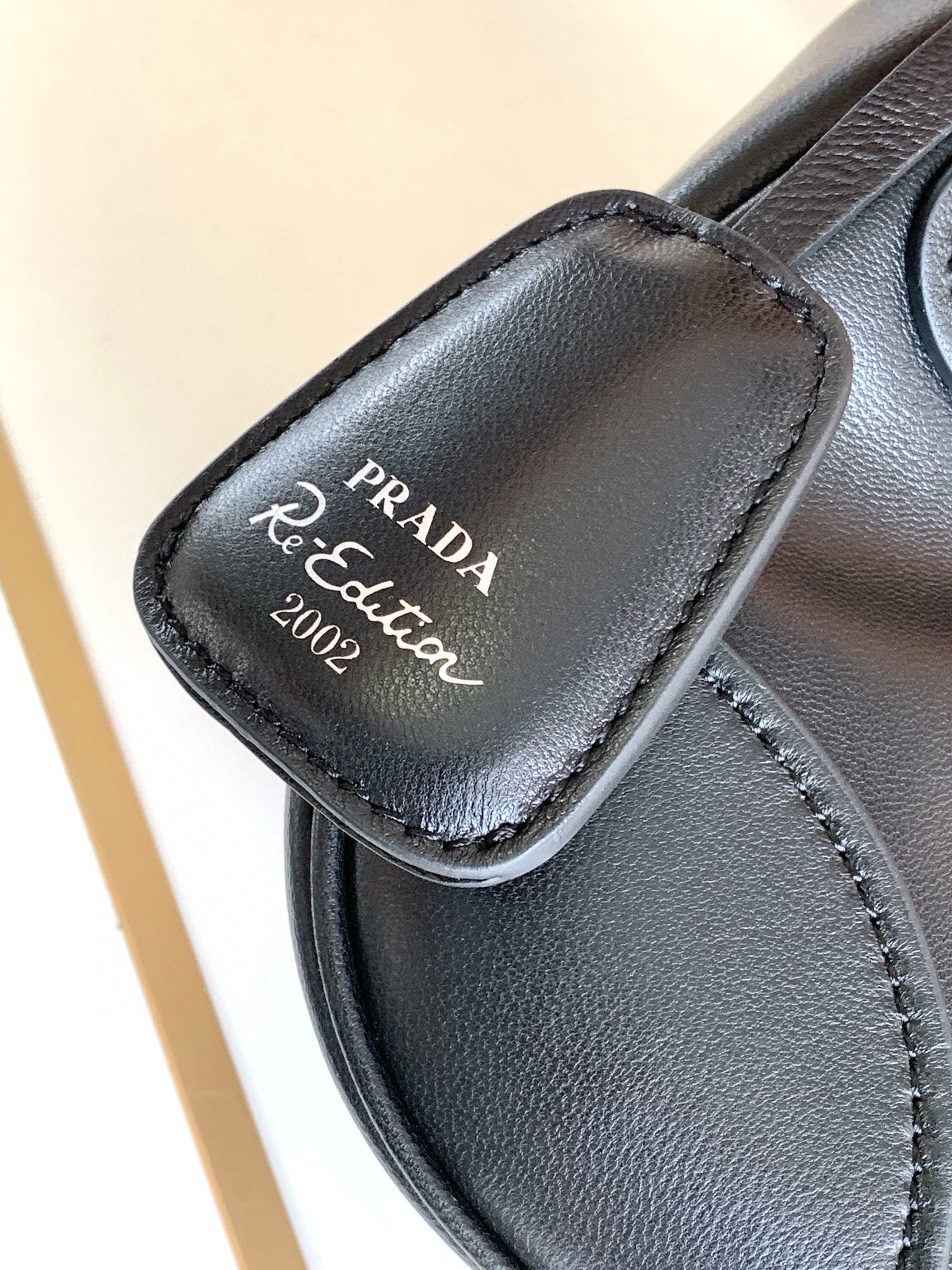 Pra*a moon bag in black re-nylon and leather