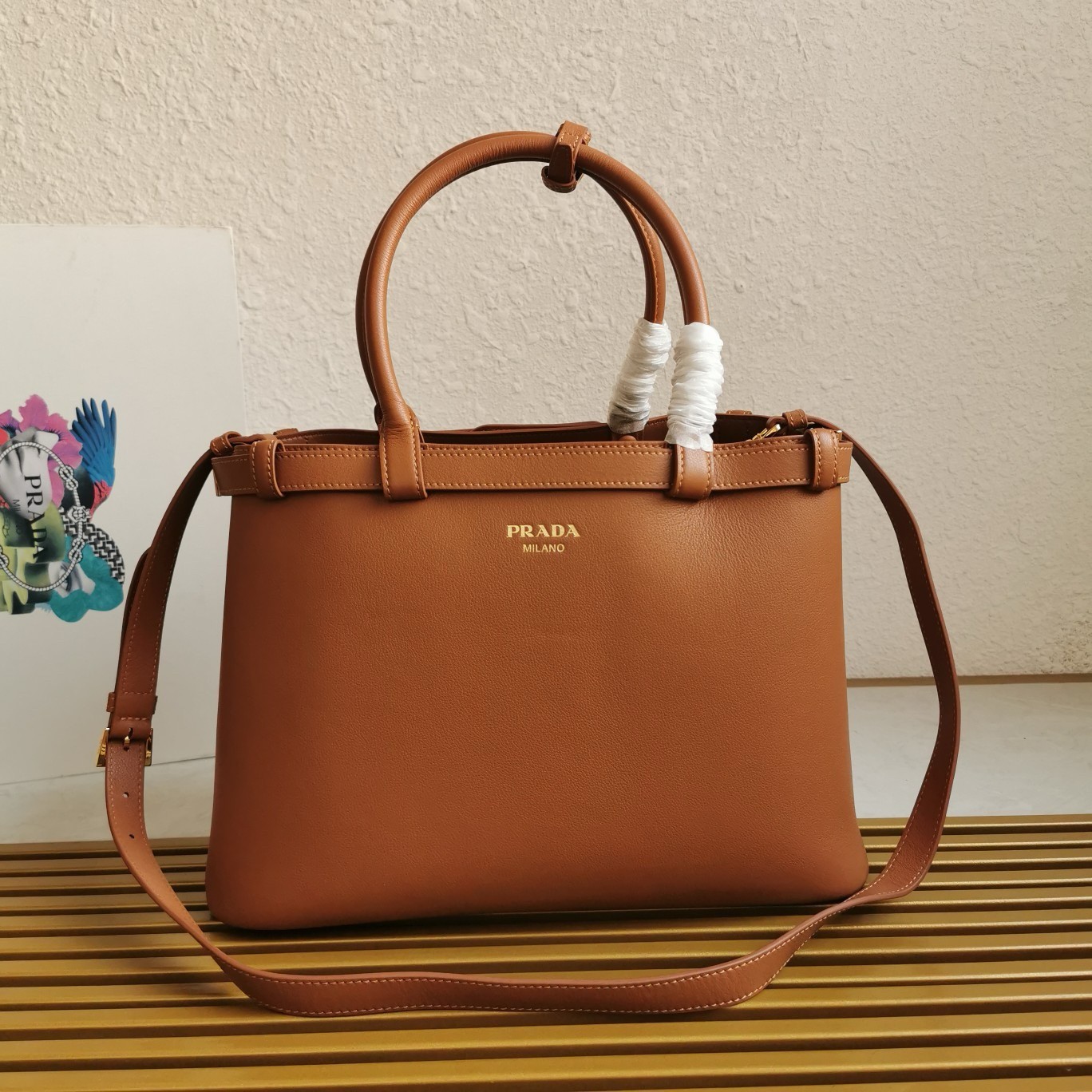 Pra*a buckle medium bag with double belt in brown leather