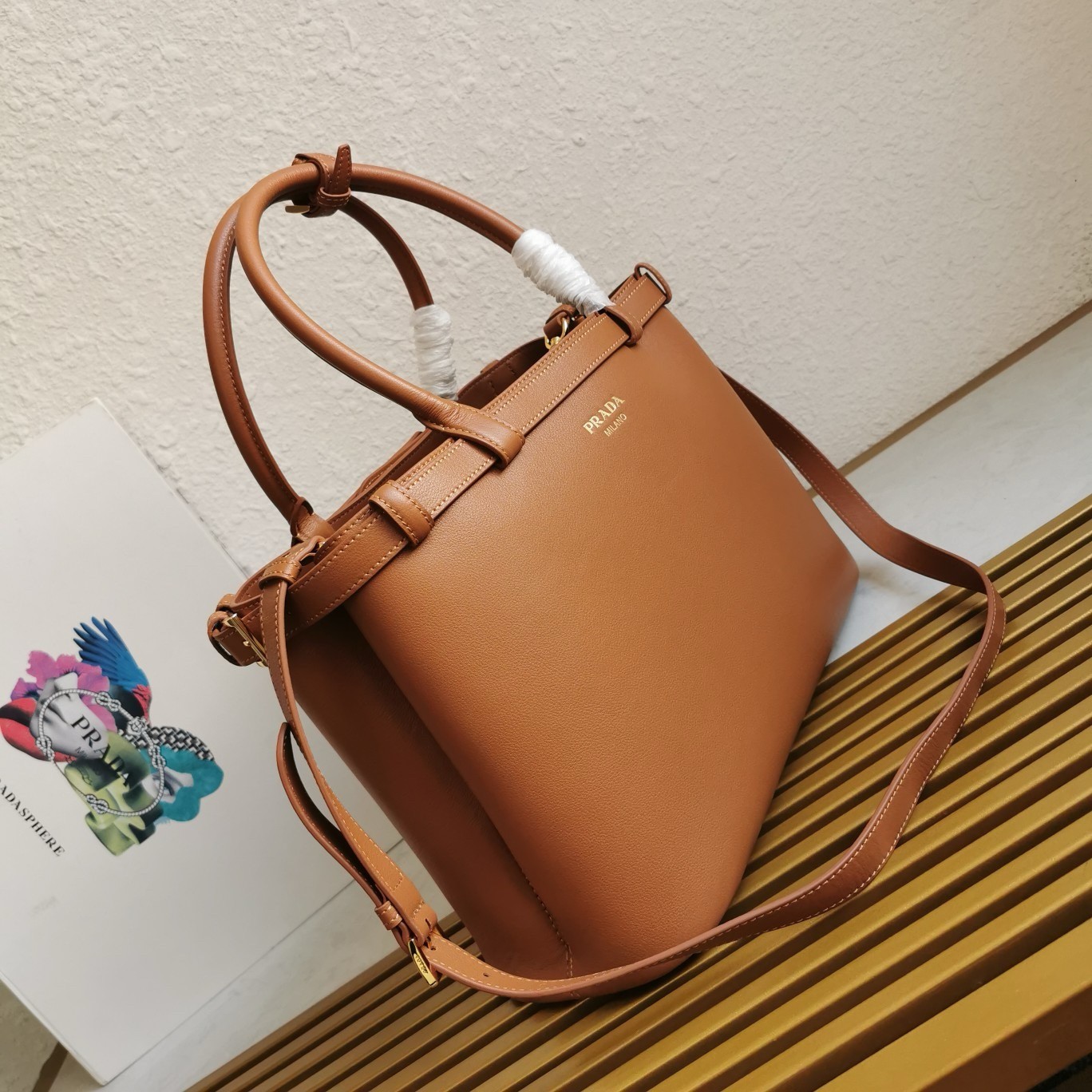 Pra*a buckle medium bag with double belt in brown leather