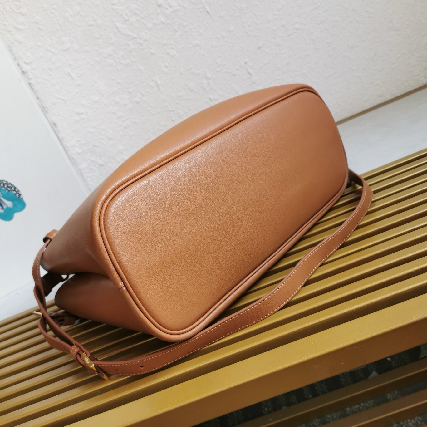 Pra*a buckle medium bag with double belt in brown leather