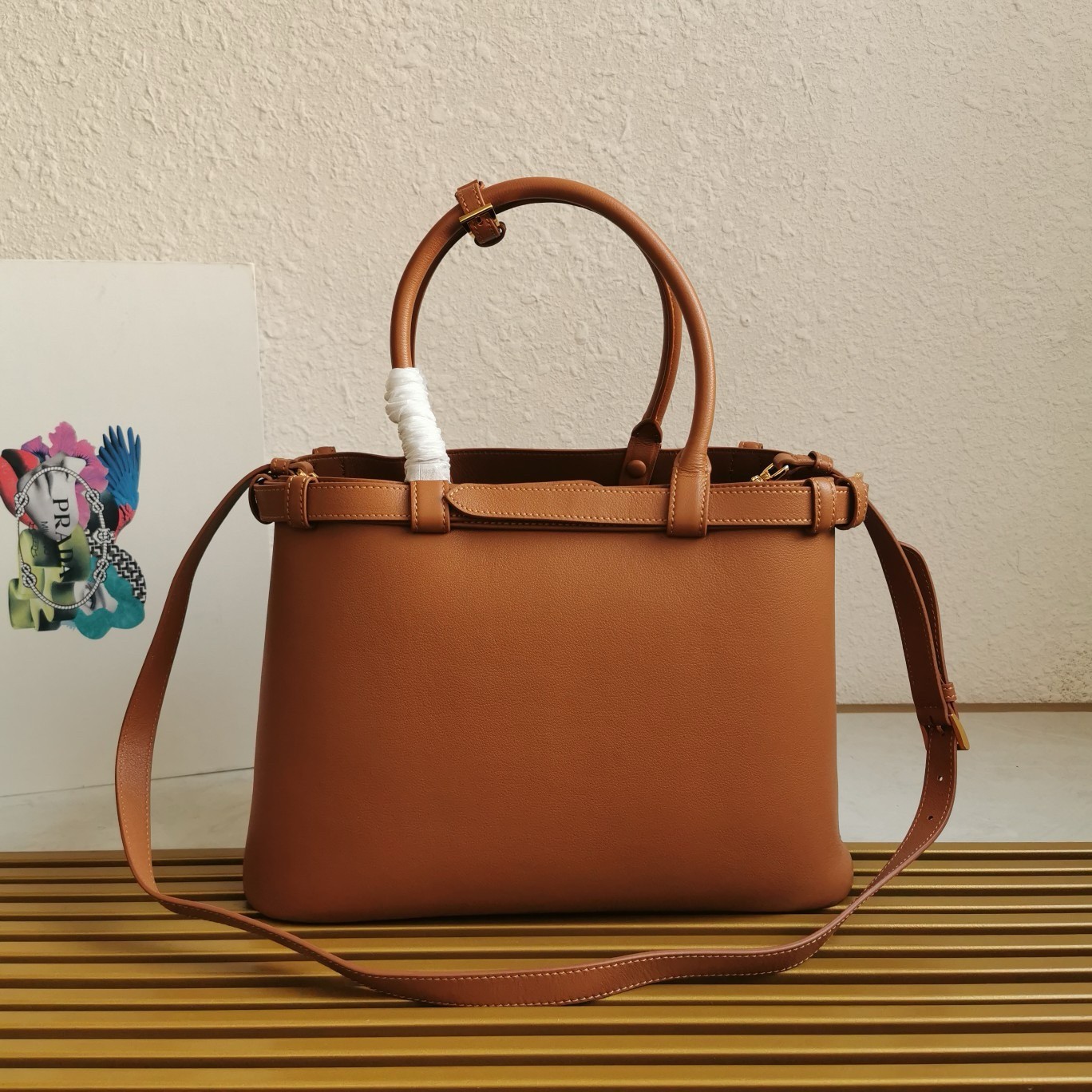 Pra*a buckle medium bag with double belt in brown leather