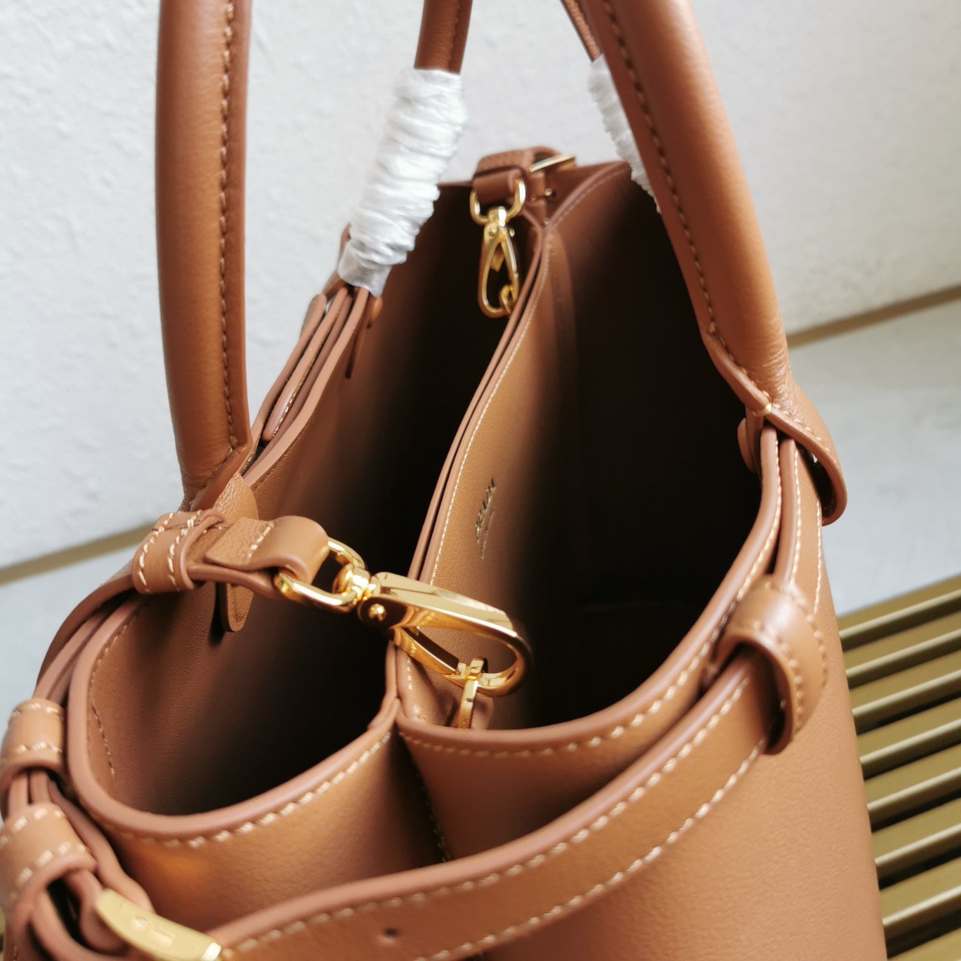Pra*a buckle medium bag with double belt in brown leather