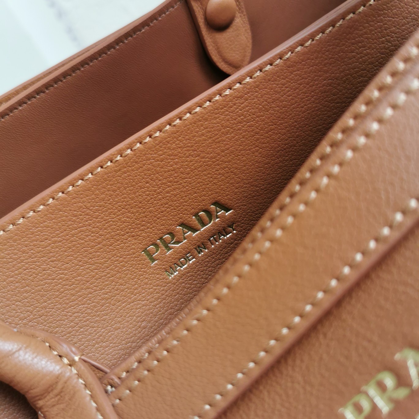 Pra*a buckle medium bag with double belt in brown leather