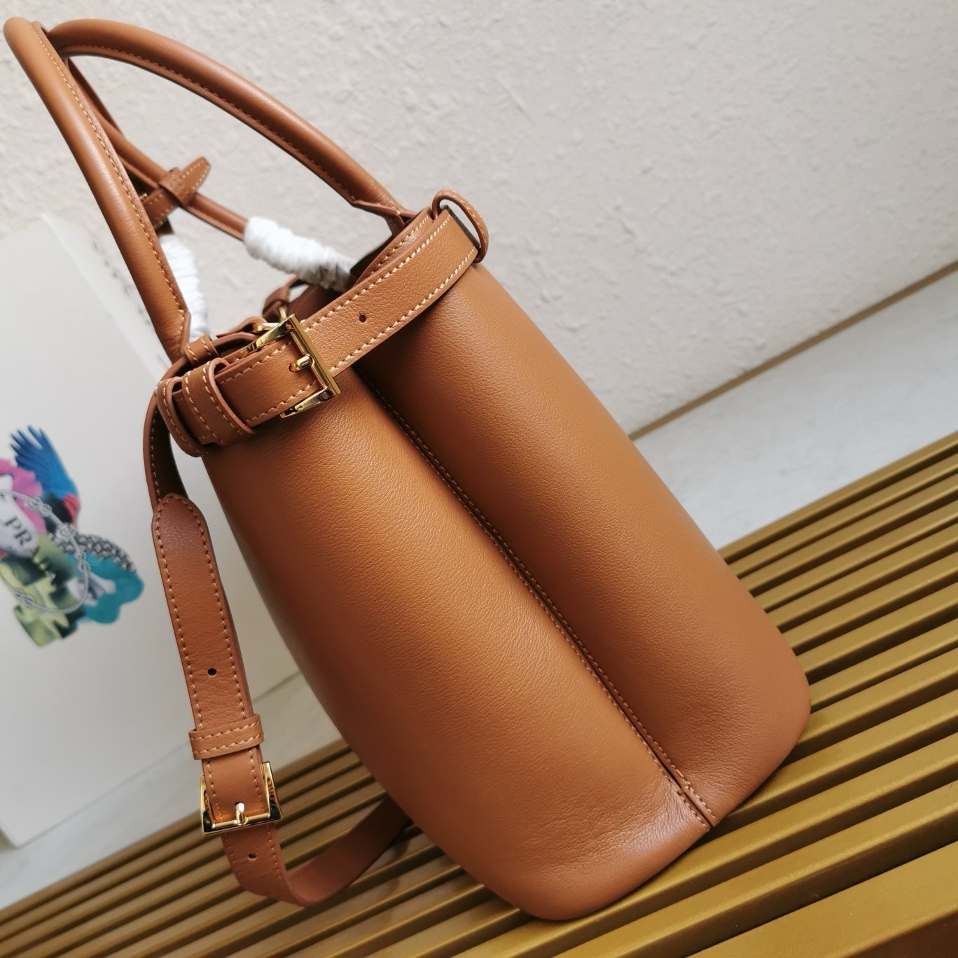 Pra*a buckle medium bag with double belt in brown leather