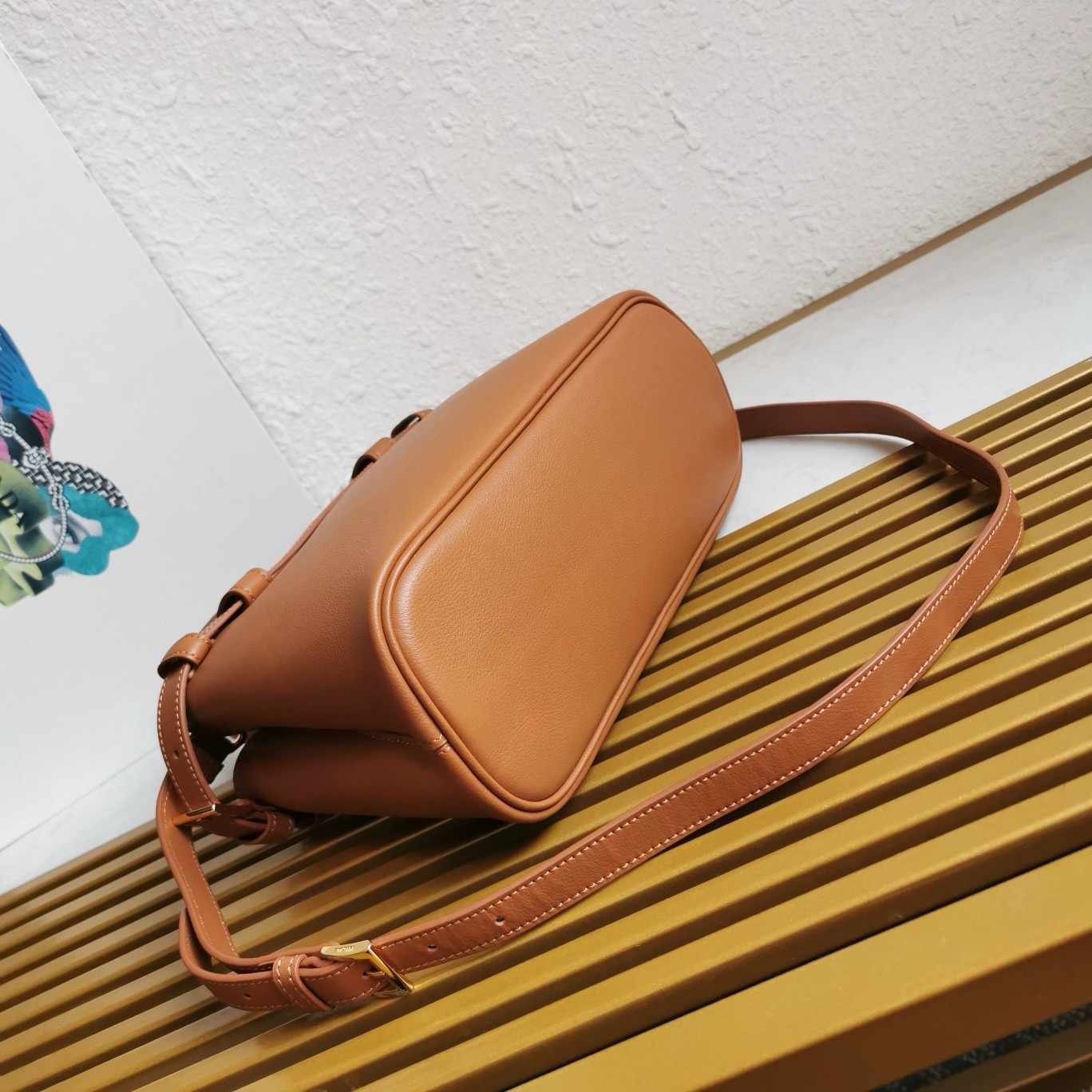 Pra*a buckle small bag with double belt in brown leather