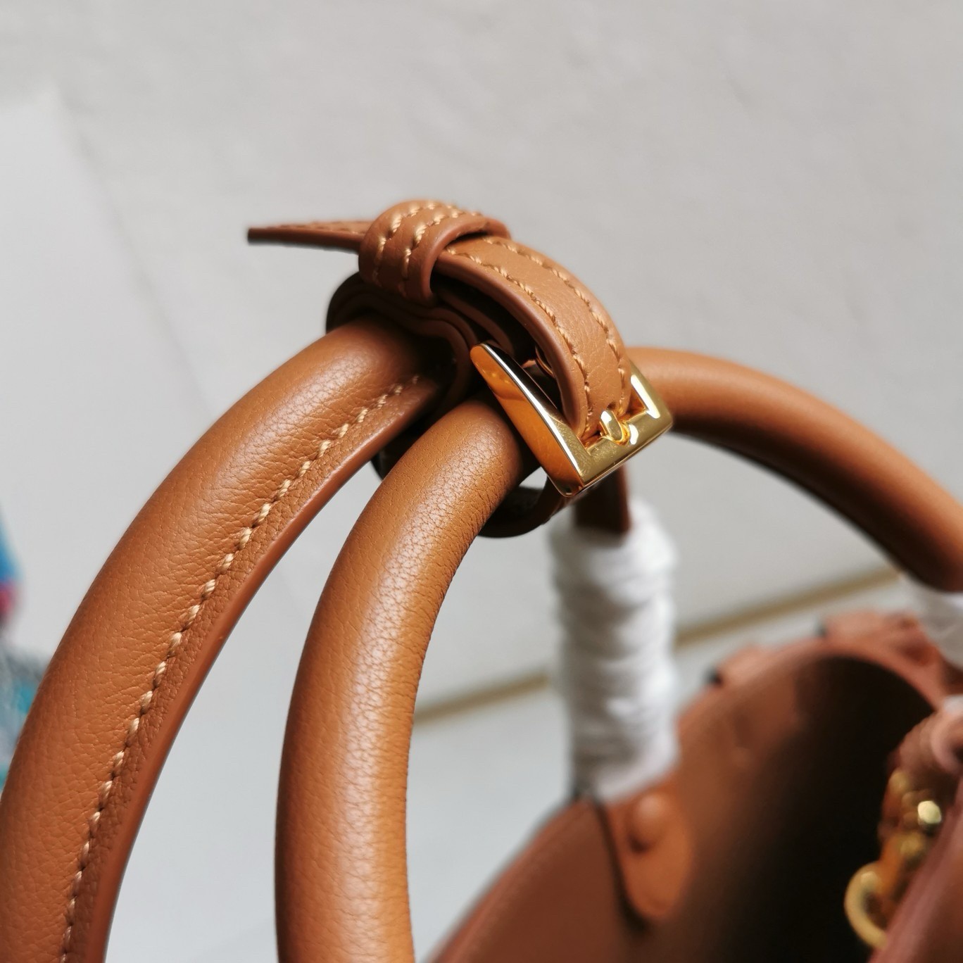 Pra*a buckle small bag with double belt in brown leather