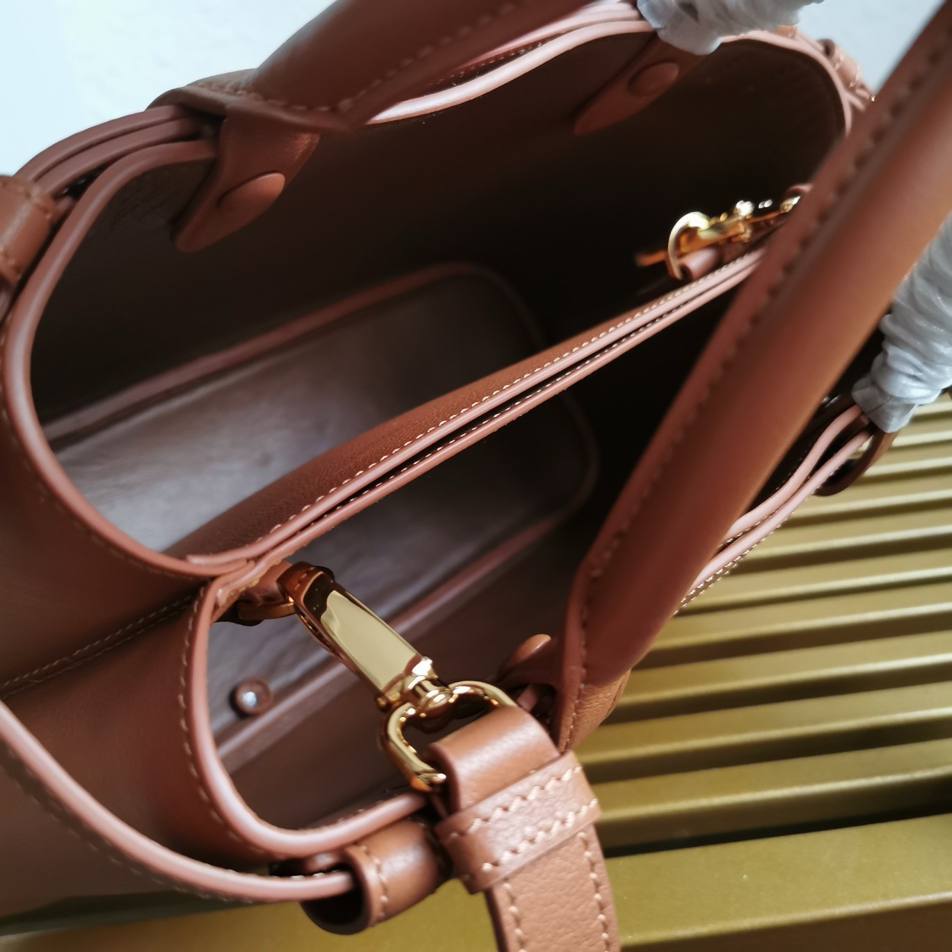 Pra*a buckle small bag with double belt in brown leather