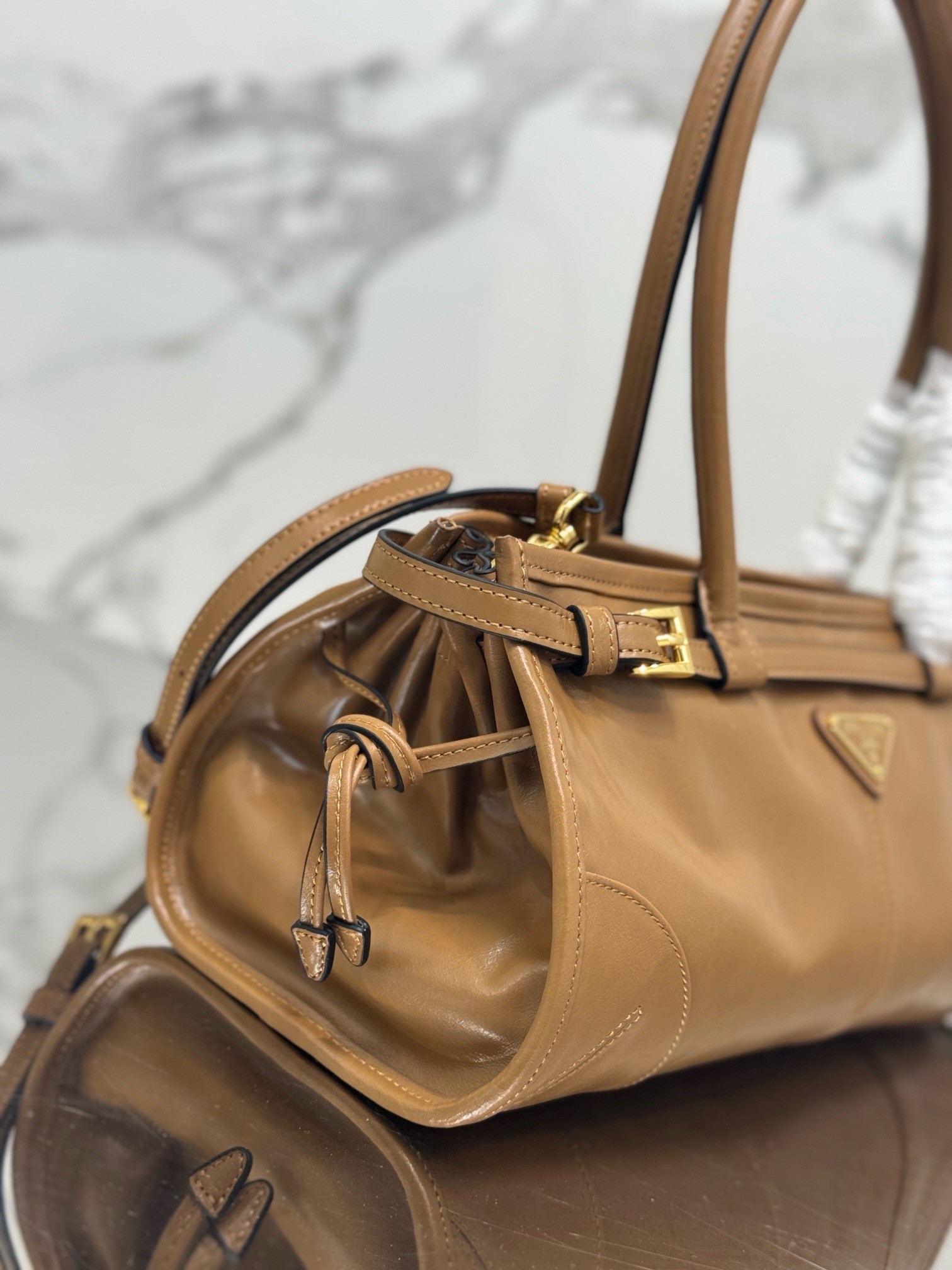 Pra*a medium tote bag in brown soft leather