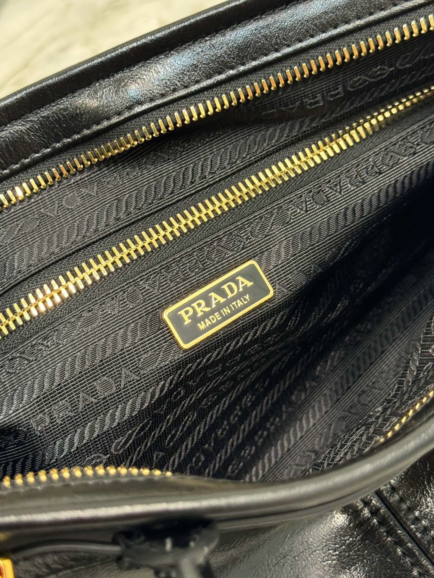 Pra*a medium tote bag in black soft leather