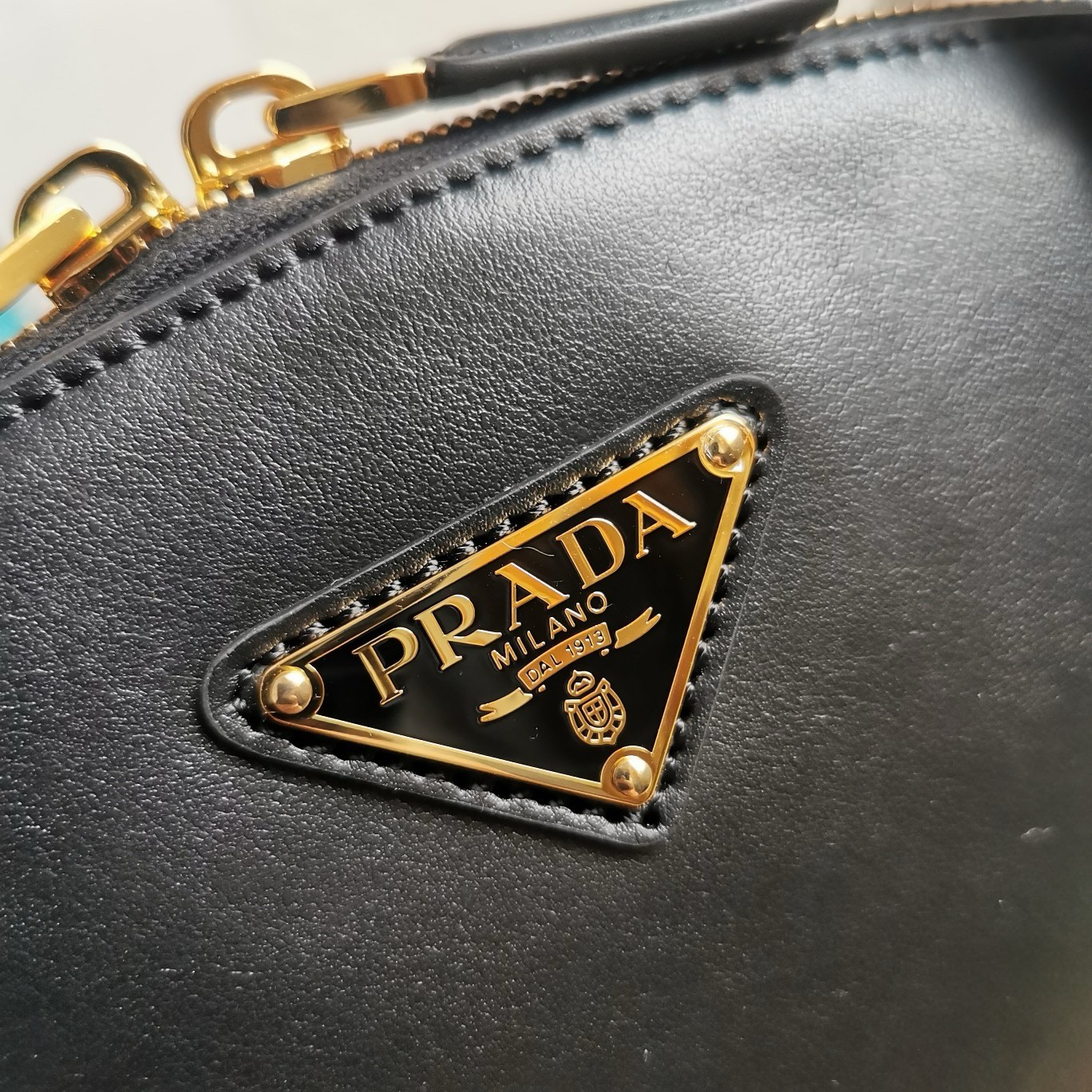 Pra*a shoulder bag with double zipper in black calfskin