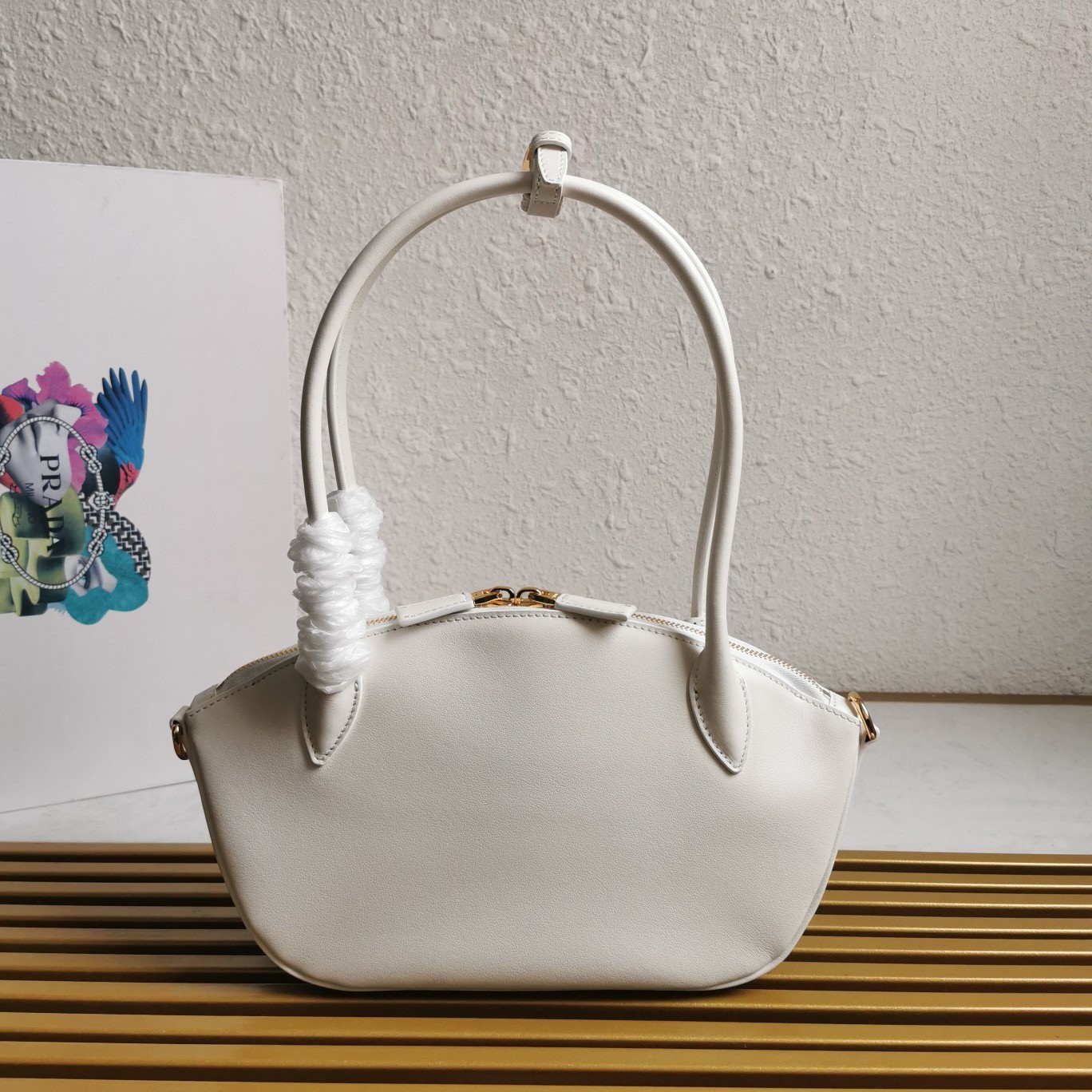 Pra*a shoulder bag with double zipper in white calfskin