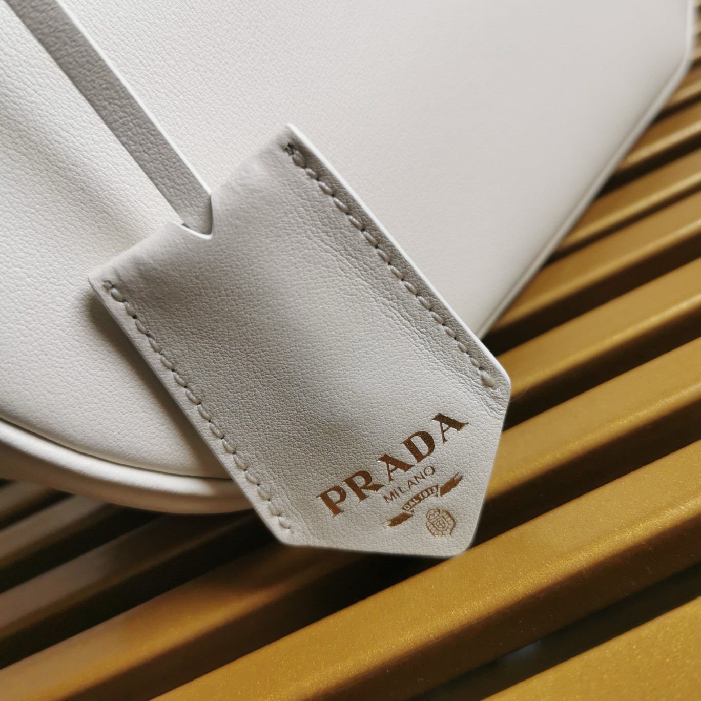 Pra*a shoulder bag with double zipper in white calfskin