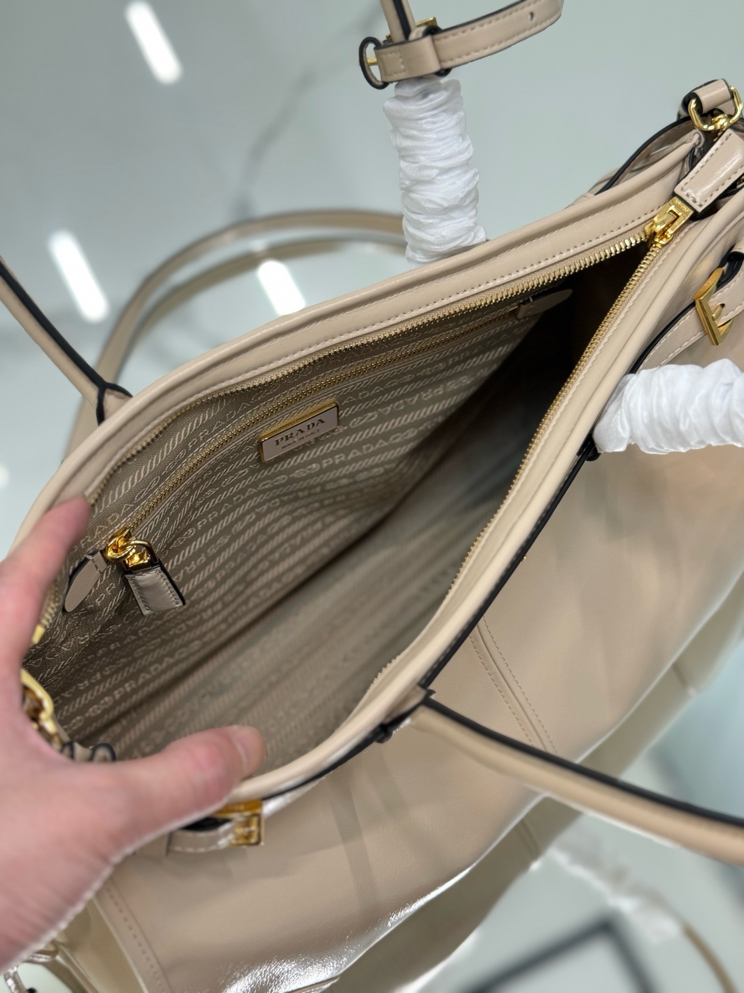 Pra*a large tote bag in beige soft leather