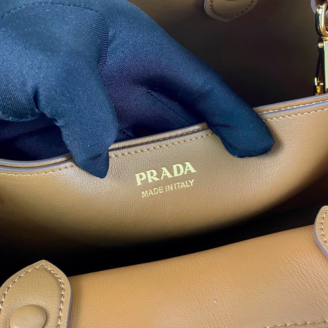 Pra*a buckle medium bag with belt in brown leather