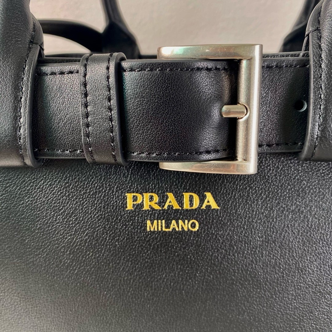 Pra*a buckle medium bag with belt in black leather