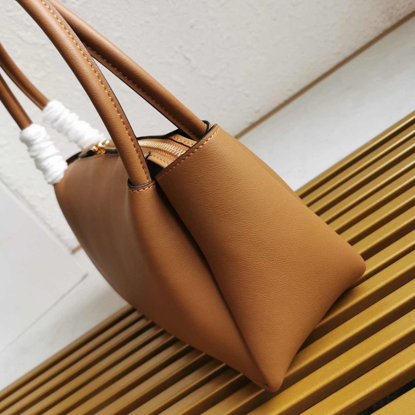 Pra*a shoulder bag in brown calfskin with triangle logo