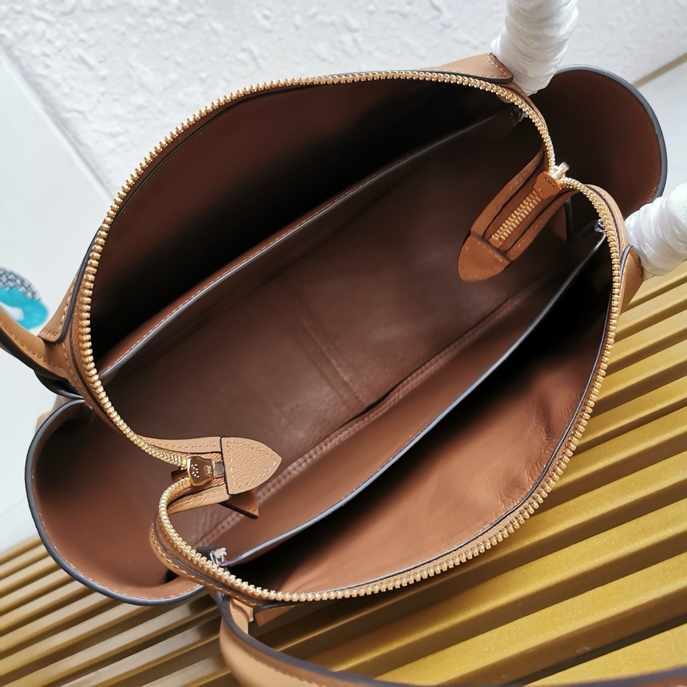Pra*a shoulder bag in brown calfskin with triangle logo
