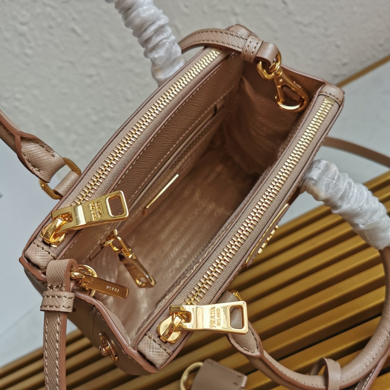 Pra*a mini galleria bag in beige saffiano leather