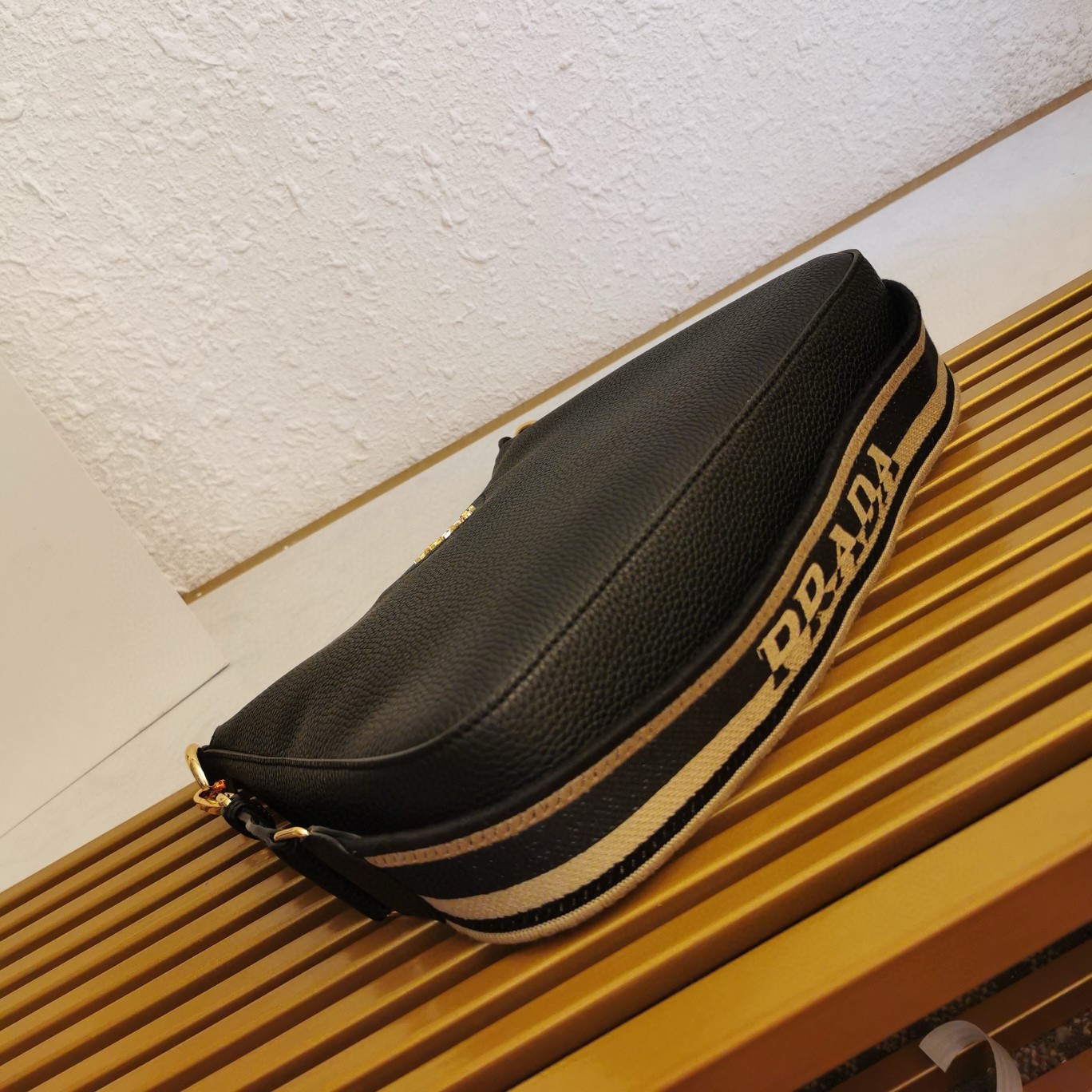Pra*a shoulder bag in black grained leather