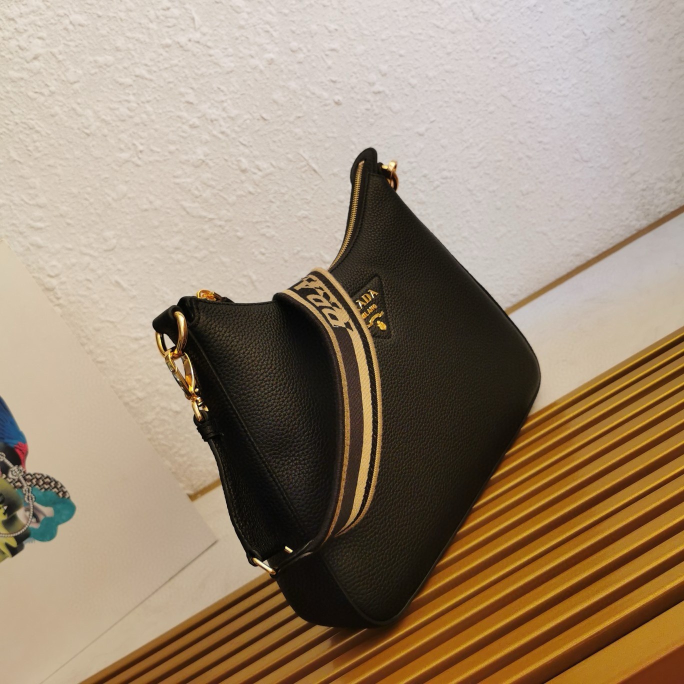 Pra*a shoulder bag in black grained leather