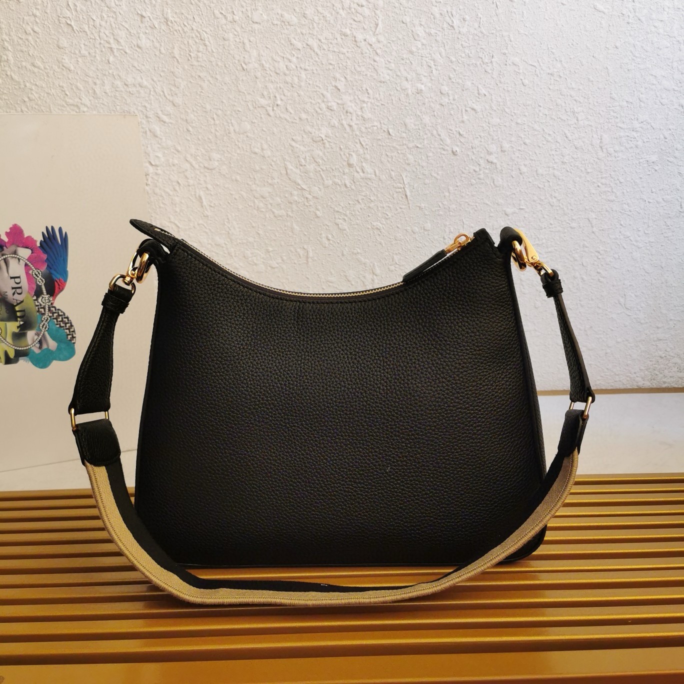 Pra*a shoulder bag in black grained leather