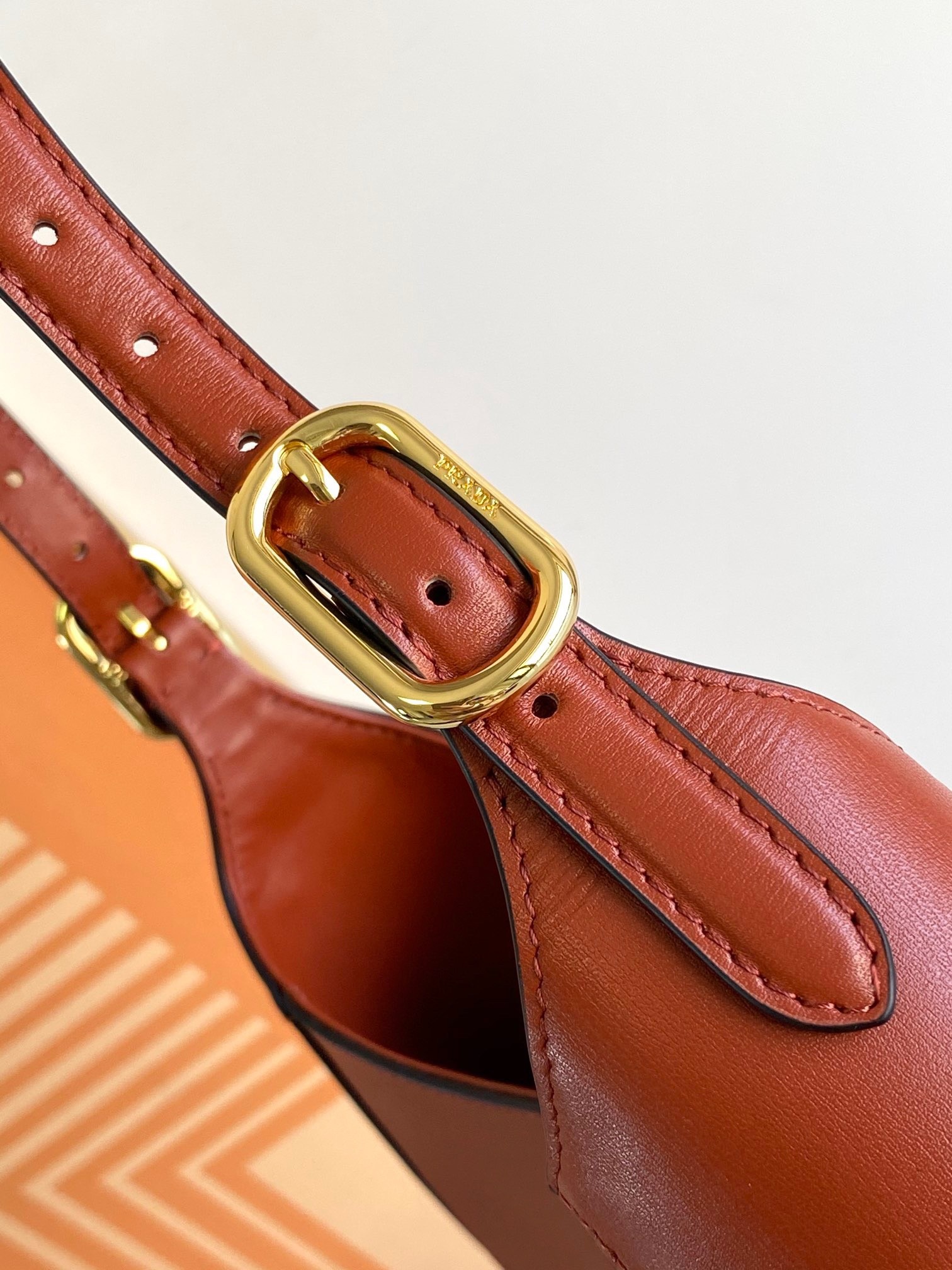 Pra*a shoulder bag in berry leather