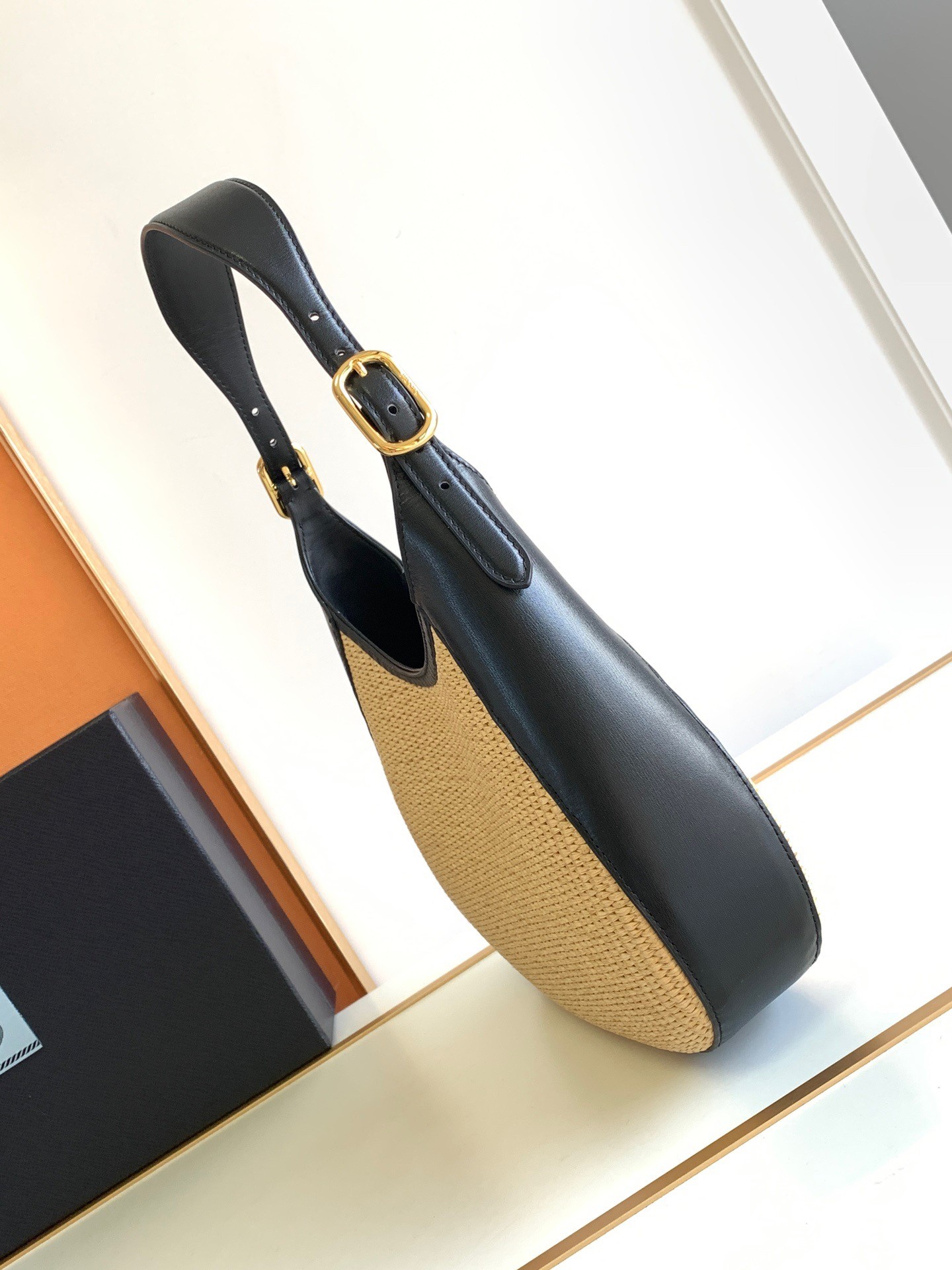 Pra*a shoulder bag in woven straw and black leather