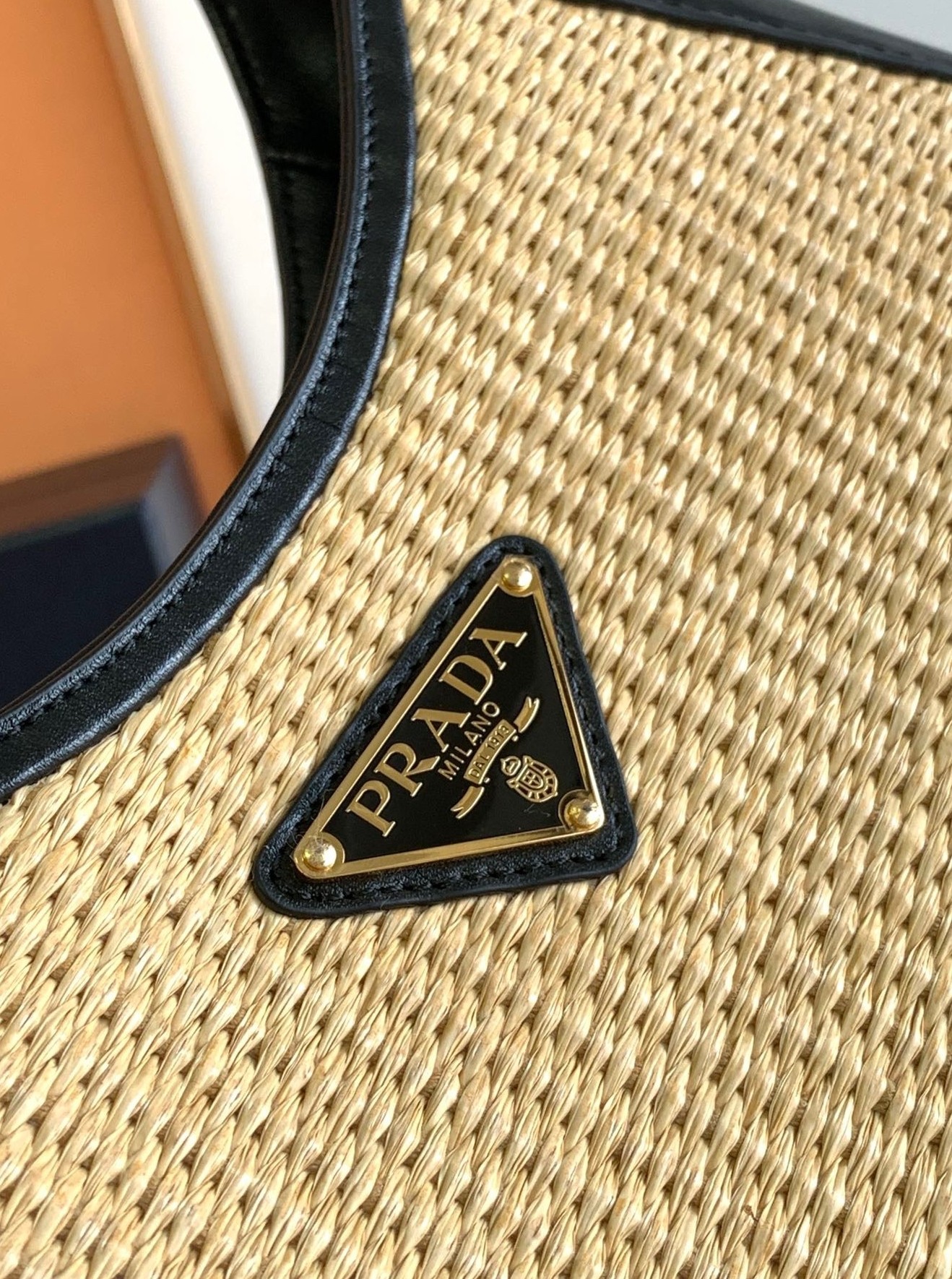 Pra*a shoulder bag in woven straw and black leather