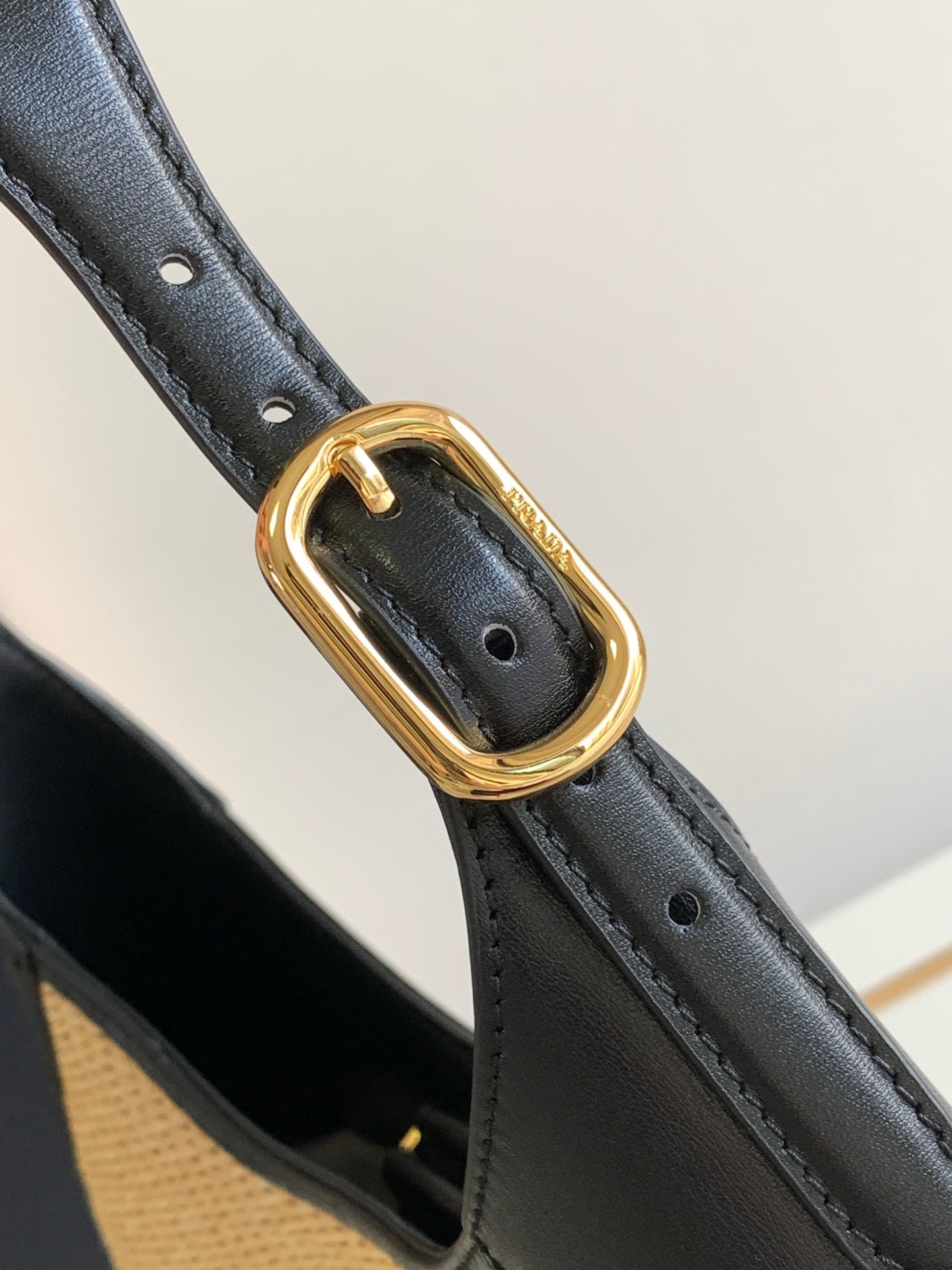 Pra*a shoulder bag in woven straw and black leather