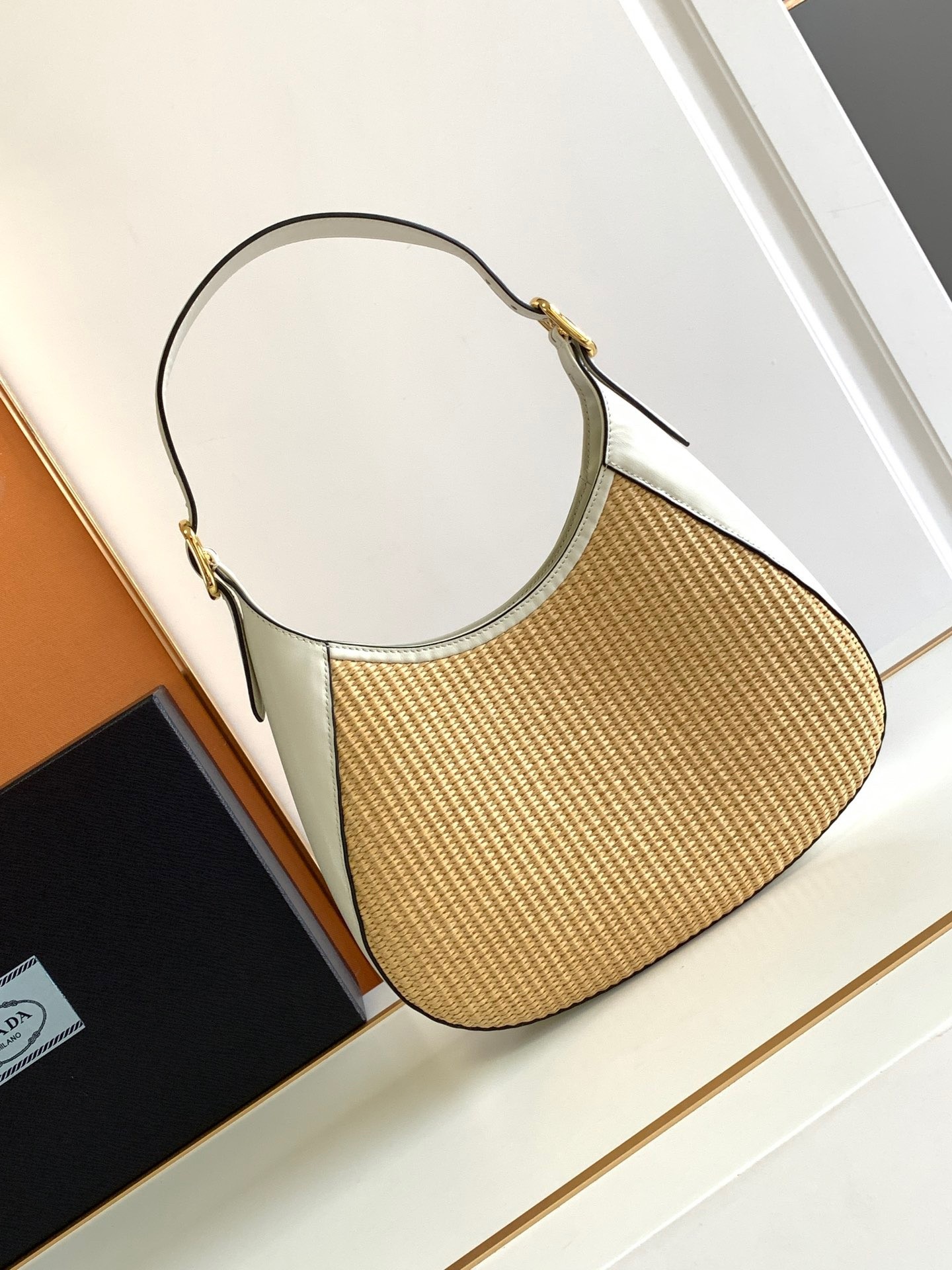 Pra*a shoulder bag in woven straw and white leather