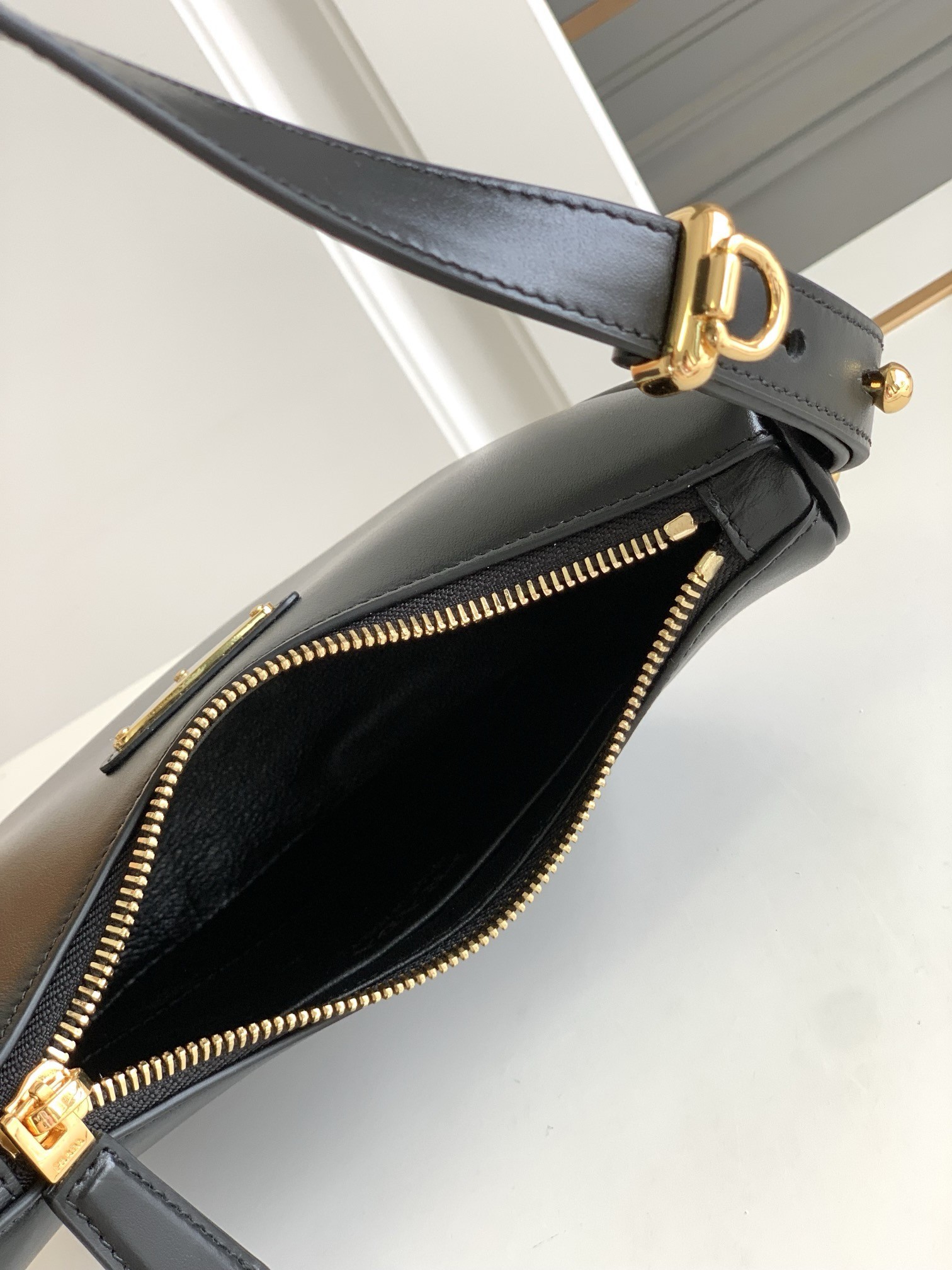 Pra*a arque mini shoulder bag in black leather