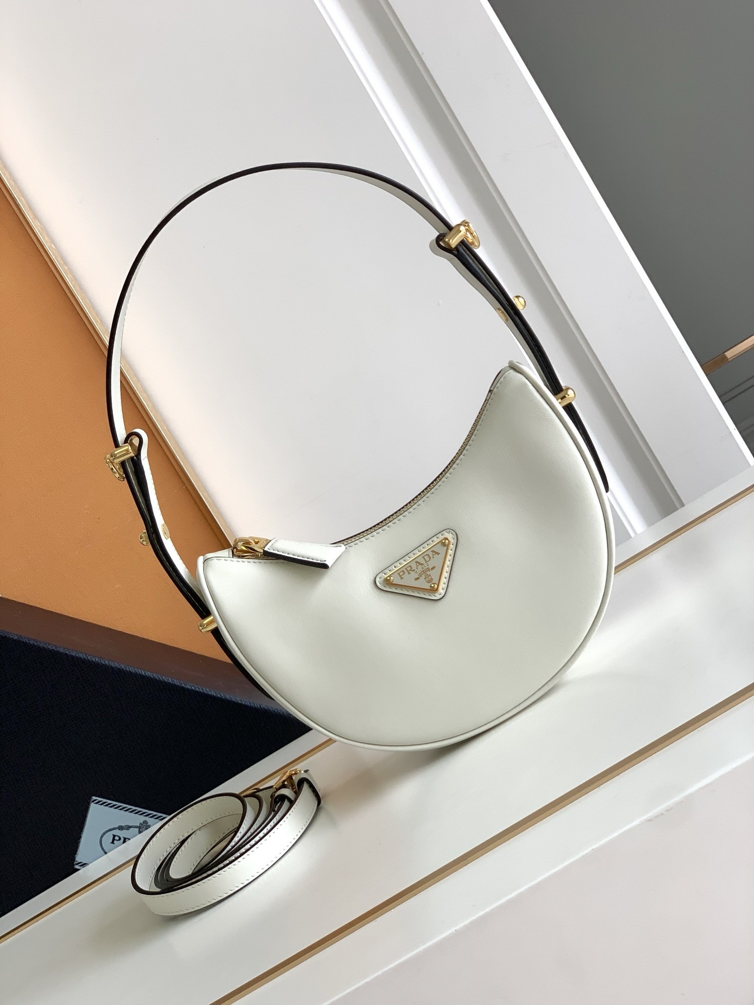 Pra*a arque mini shoulder bag in white leather