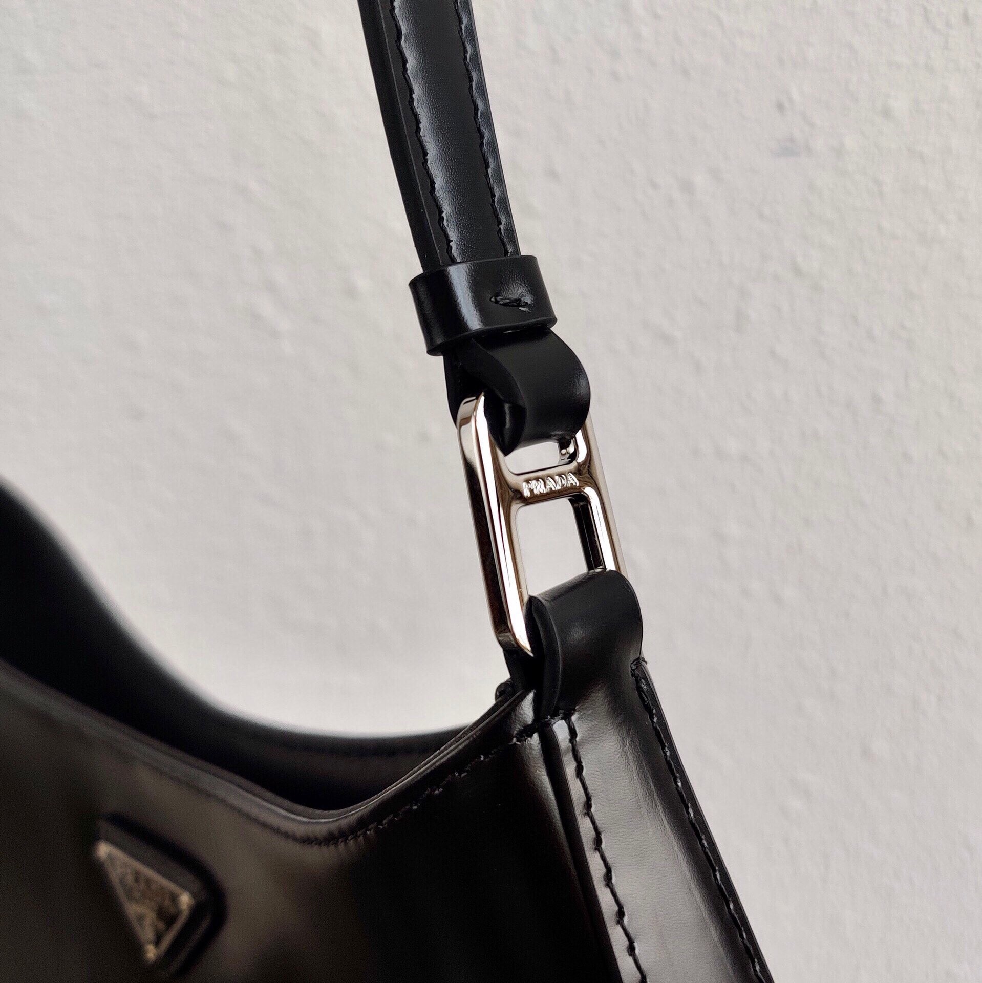 Pra*a cleo small shoulder bag in black brushed leather