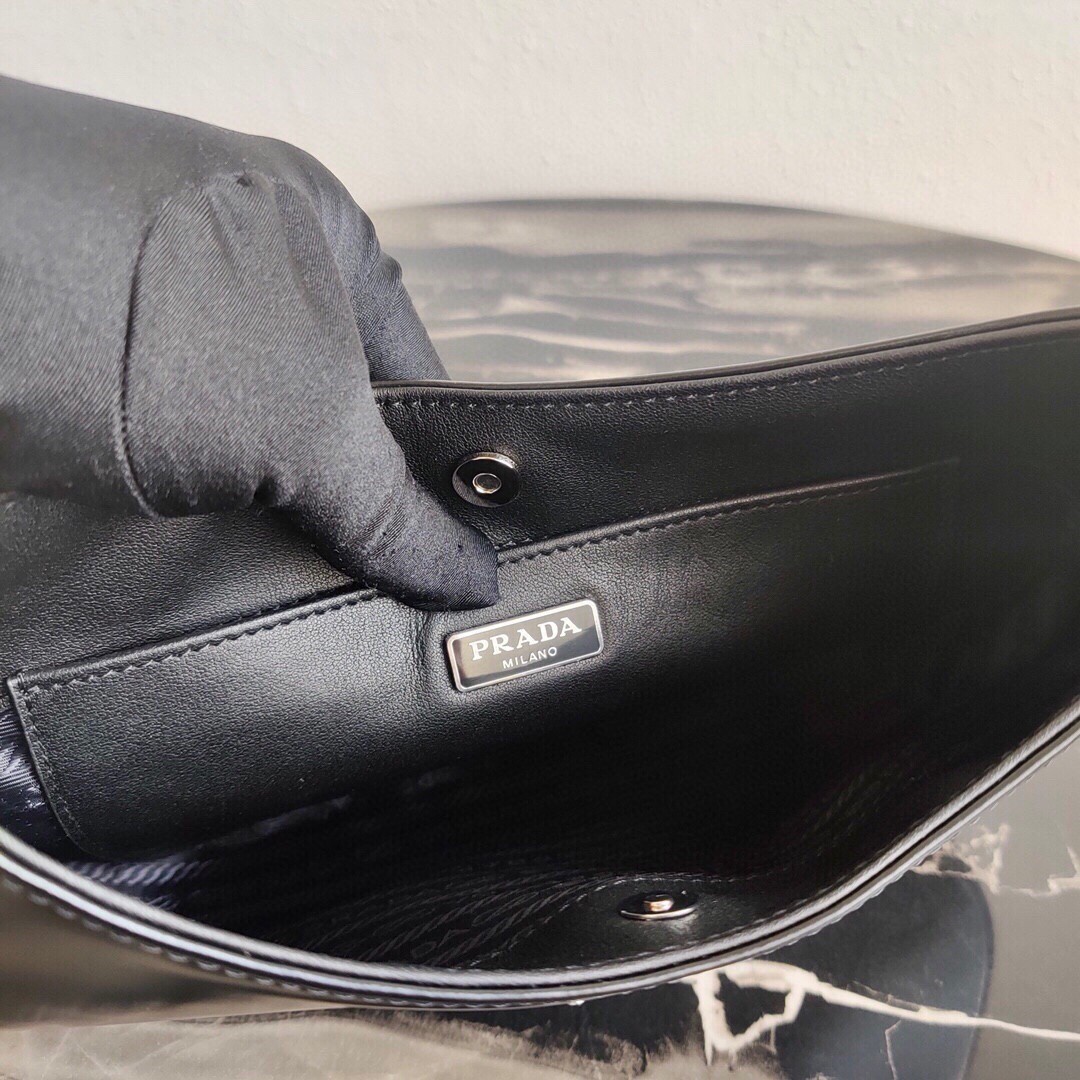Pra*a cleo small shoulder bag in black brushed leather