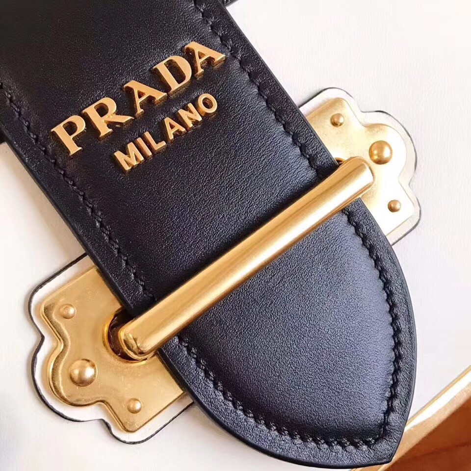 Pra*a cahier shoulder bag in white/black leather
