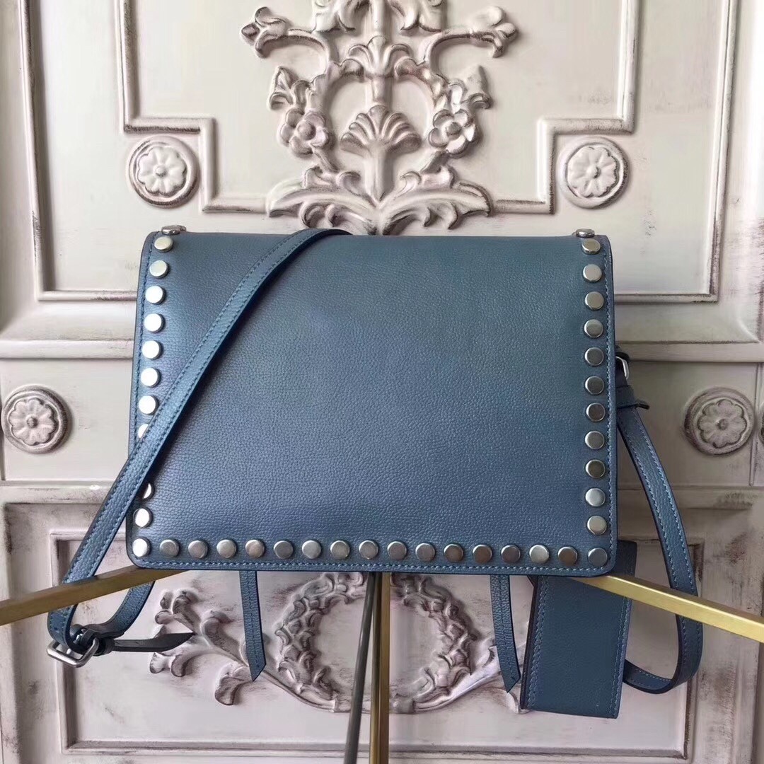 Pra*a etiquette bag in blue calfskin with metal stud trim
