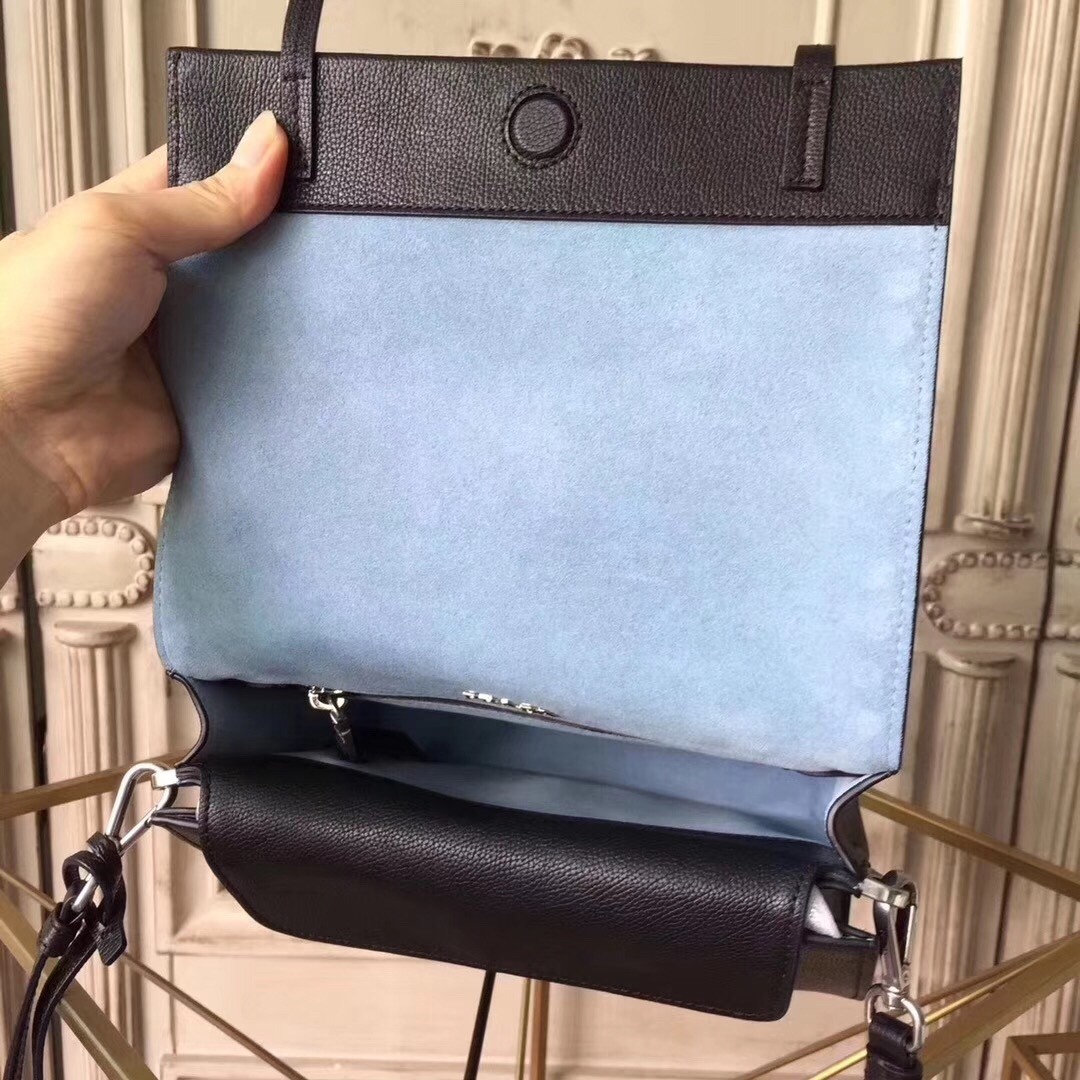 Pra*a etiquette bag in black calfskin with metal stud trim