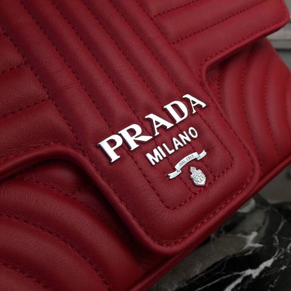 Pra*a diagramme flap bag in red calfskin